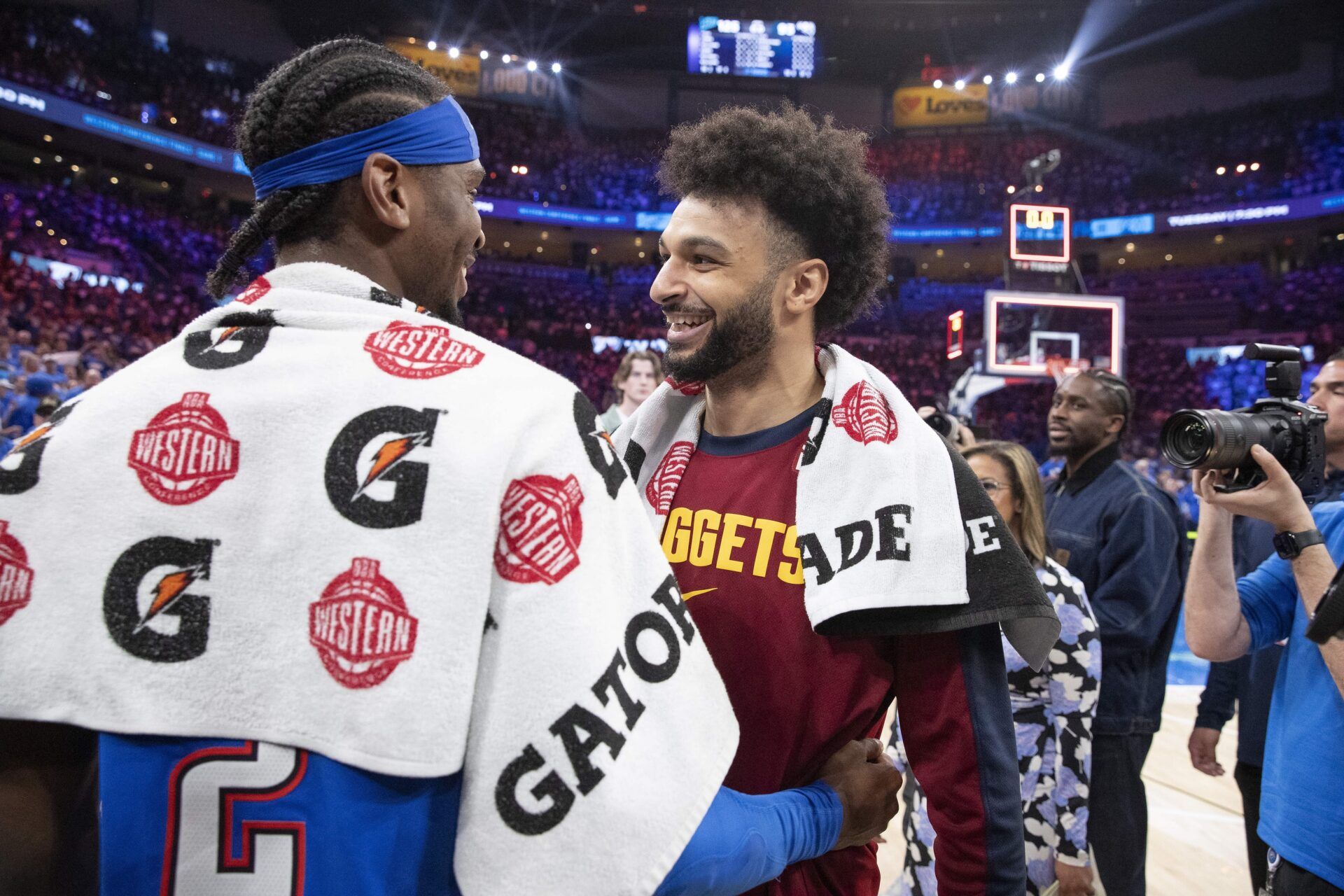 Denver Nuggets guard Jamal Murray (27) and Oklahoma City Thunder guard Shai Gilgeous-Alexander (2) hug after their game seven of the second round for the 2025 NBA Playoffs at Paycom Center.