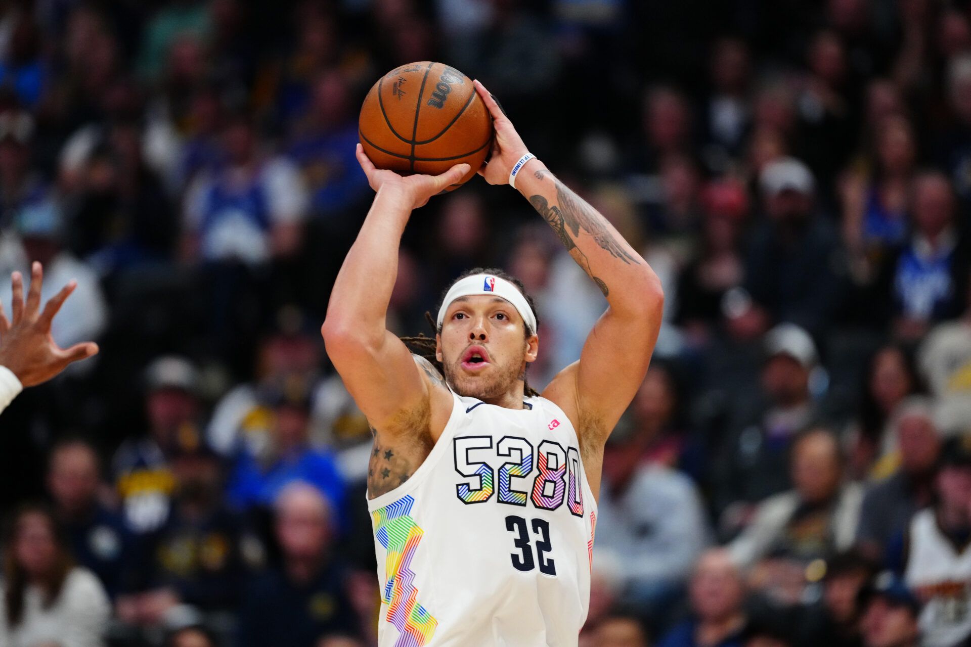 Denver Nuggets forward Aaron Gordon (32) shoots a three point basket in the fourth quarter against the LA Clippers during game five of the first round for the 2025 NBA Playoffs at Ball Arena.
