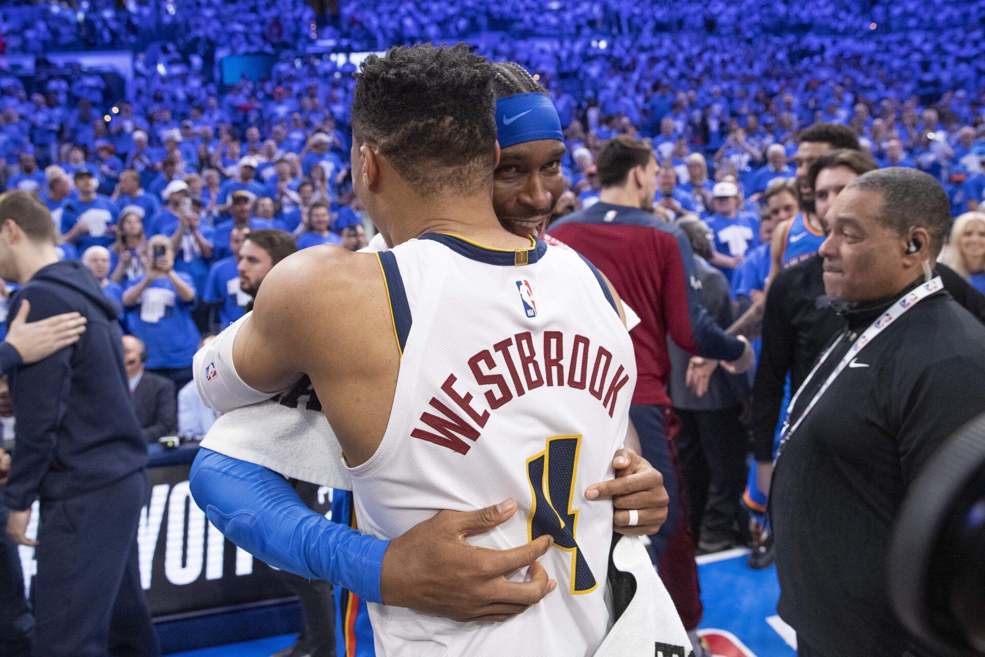 Oklahoma City Thunder guard Shai Gilgeous-Alexander (2) and Denver Nuggets guard Russell Westbrook (4) hug after their game seven of the second round for the 2025 NBA Playoffs at Paycom Center.