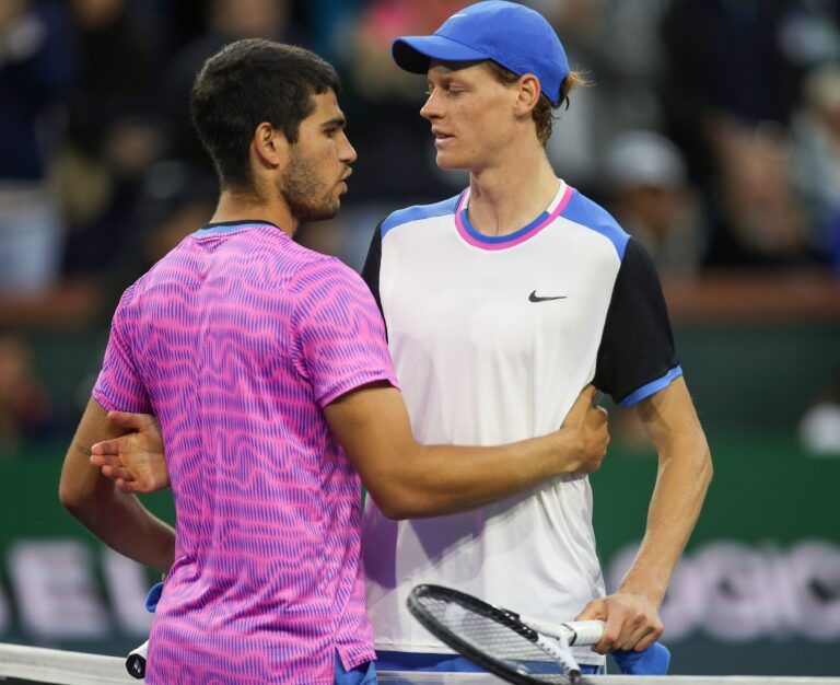Jannik Sinner and Carlos Alcaraz meet at the net after their semifinal match at the BNP Paribas Open in Indian Wells, Calif., March 16, 2024.