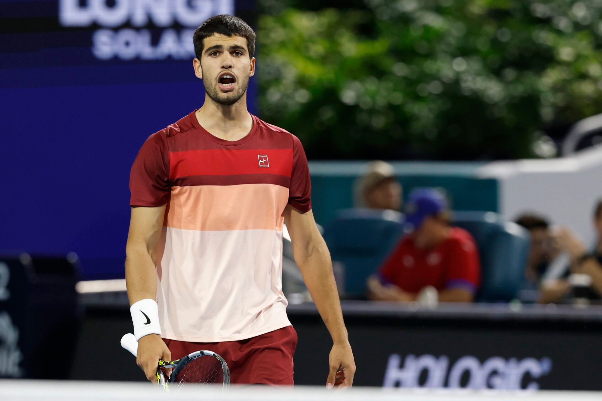 Carlos Alcaraz (ESP) talks to his box between points against David Goffin (BEL)(not pictured) on day four of the Miami Open at Hard Rock Stadium.