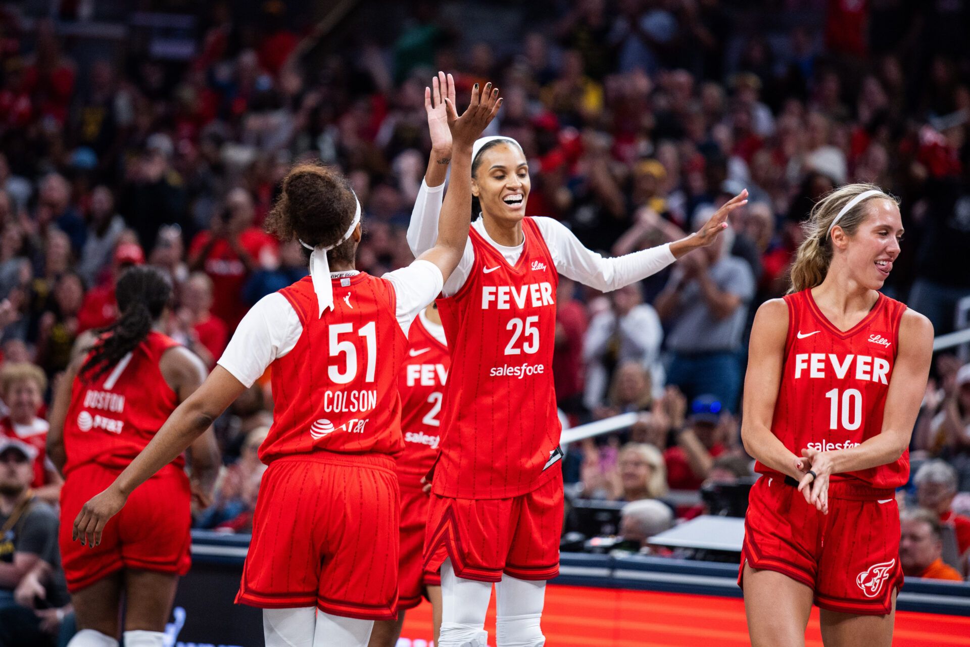 Indiana Fever forward DeWanna Bonner (25) celebrates becoming the 3rd most leading points scorer in the WNBA in the second half against the Chicago Sky at Gainbridge Fieldhouse.