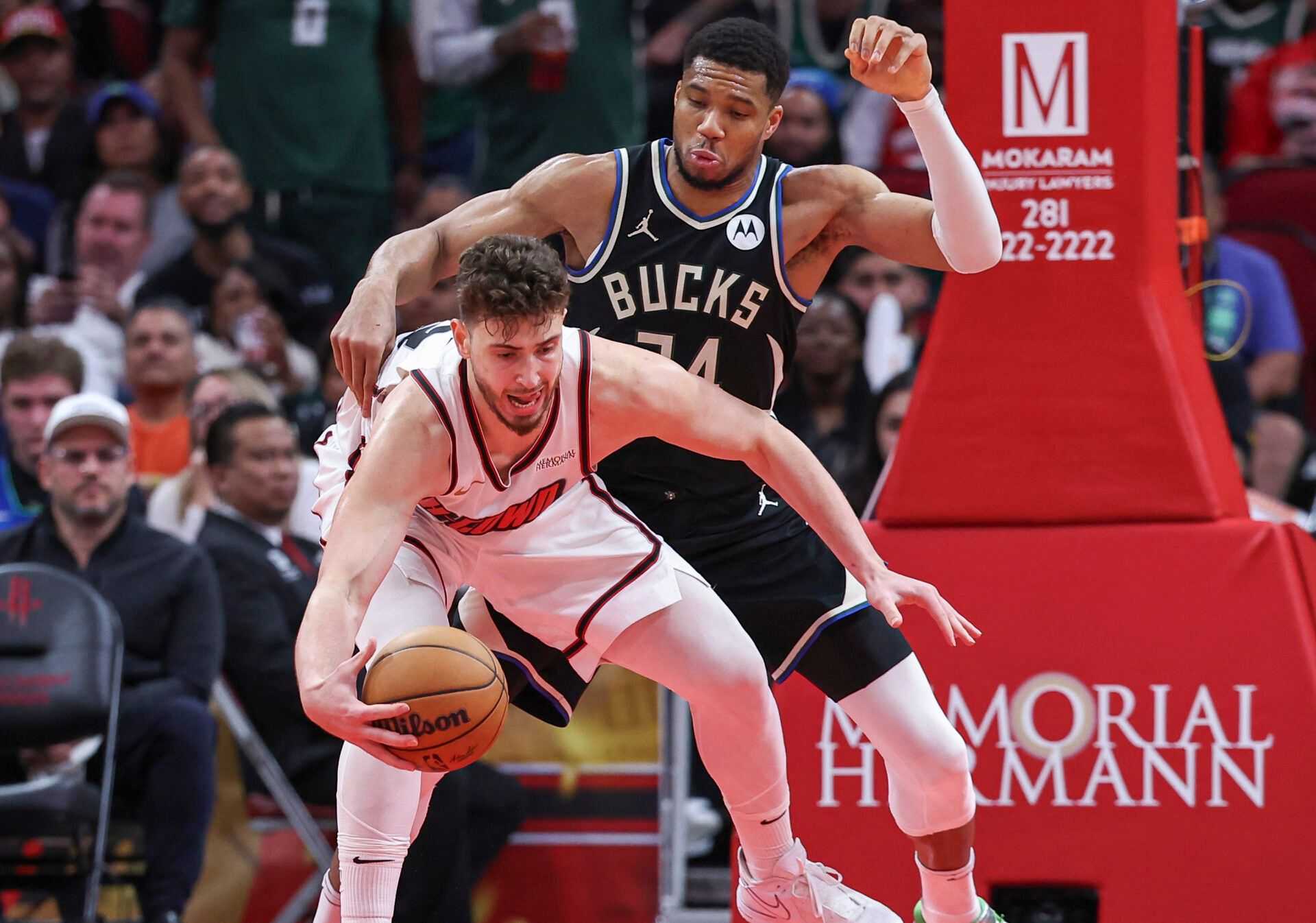 Milwaukee Bucks forward Giannis Antetokounmpo (34) defends against Houston Rockets center Alperen Sengun (28) during the fourth quarter at Toyota Center.