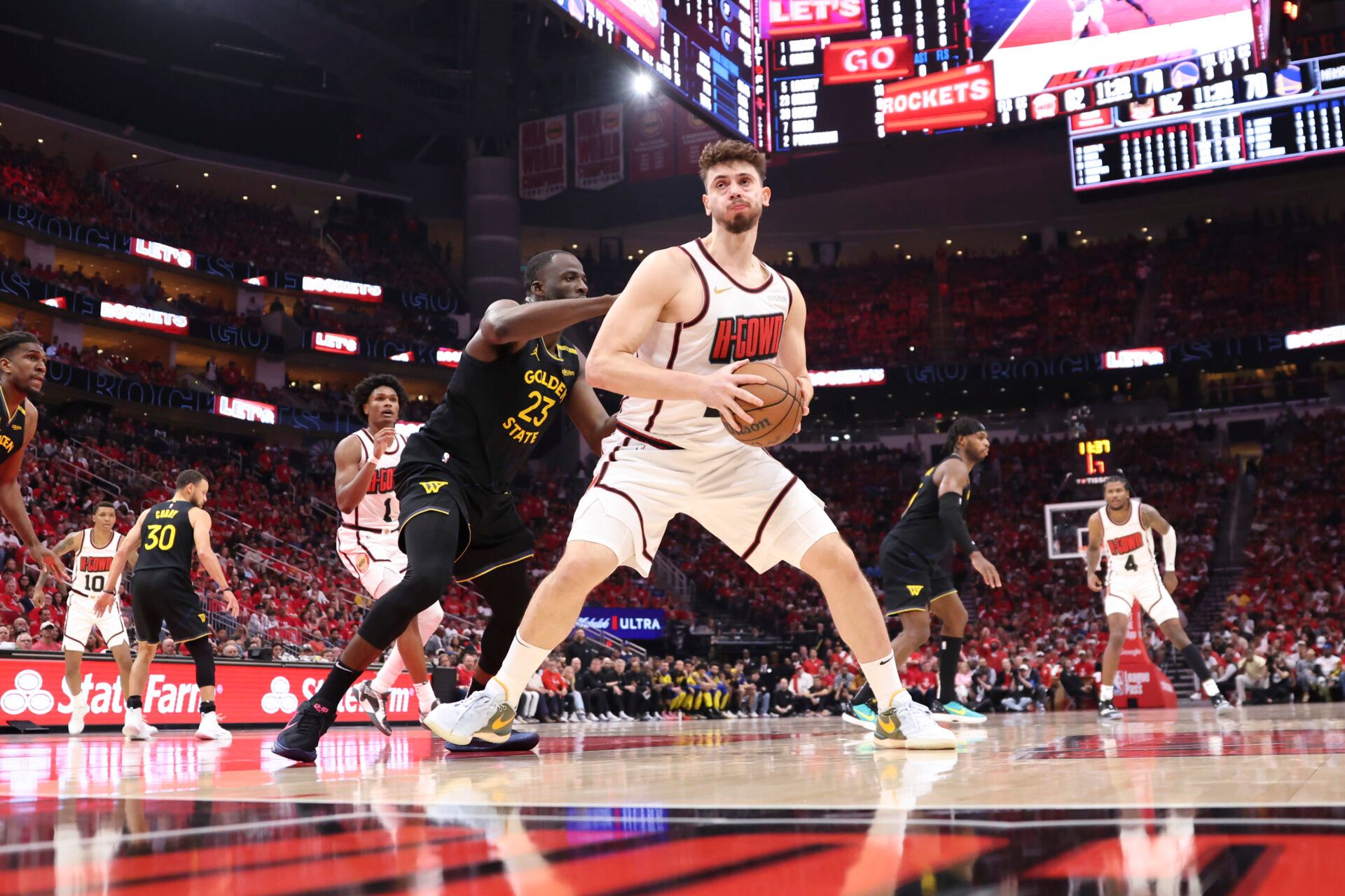 Golden State Warriors forward Draymond Green (23) defends against Houston Rockets center Alperen Sengun (28) during game seven of the first round for the 2025 NBA Playoffs at Toyota Center.
