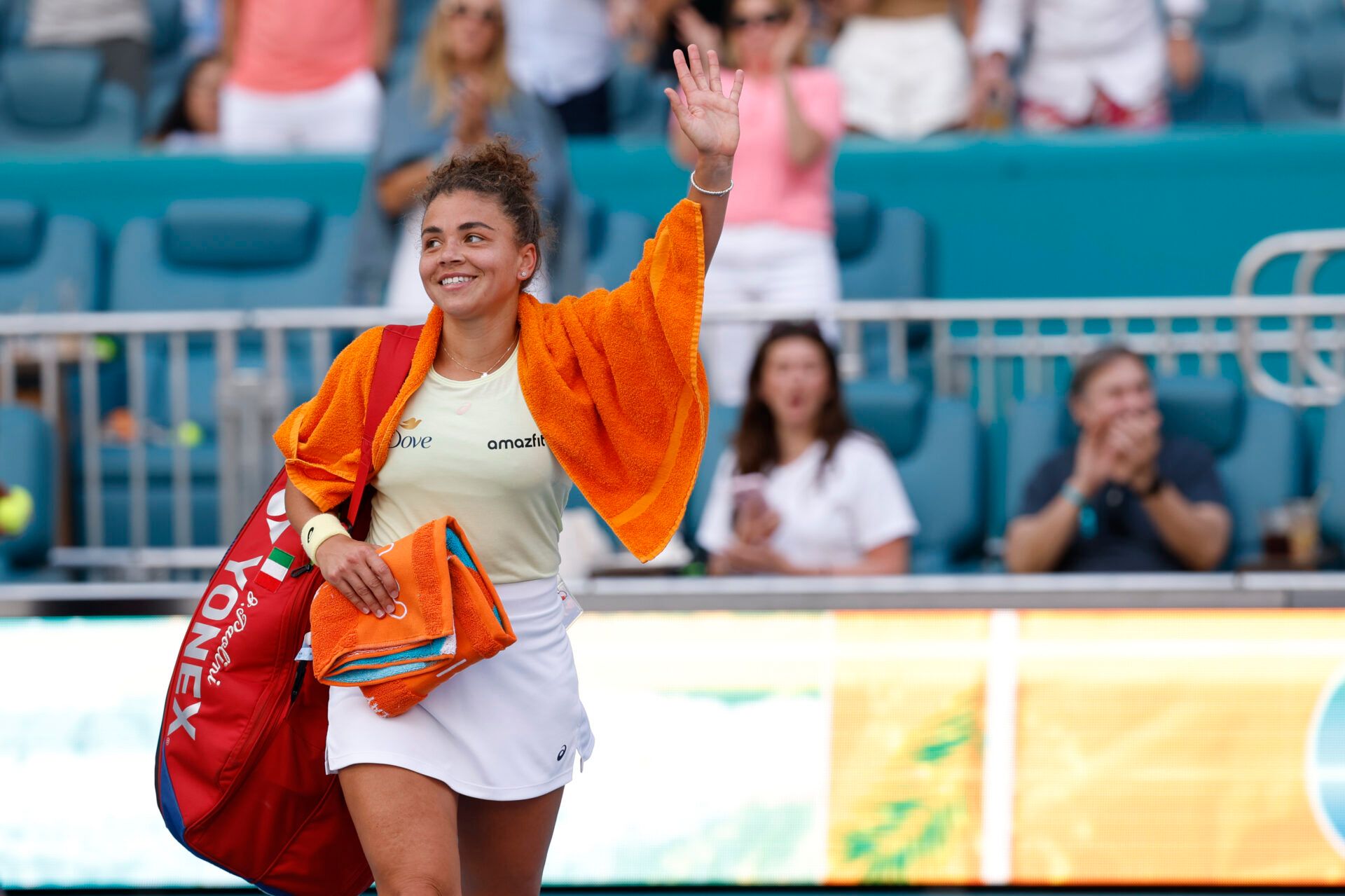 Jasmine Paolini (ITA) waves to the crowd while leaving the court after her match against Aryna Sabalenka(not pictured) after a women's singles semifinal on day ten of the Miami Open at Hard Rock Stadium.