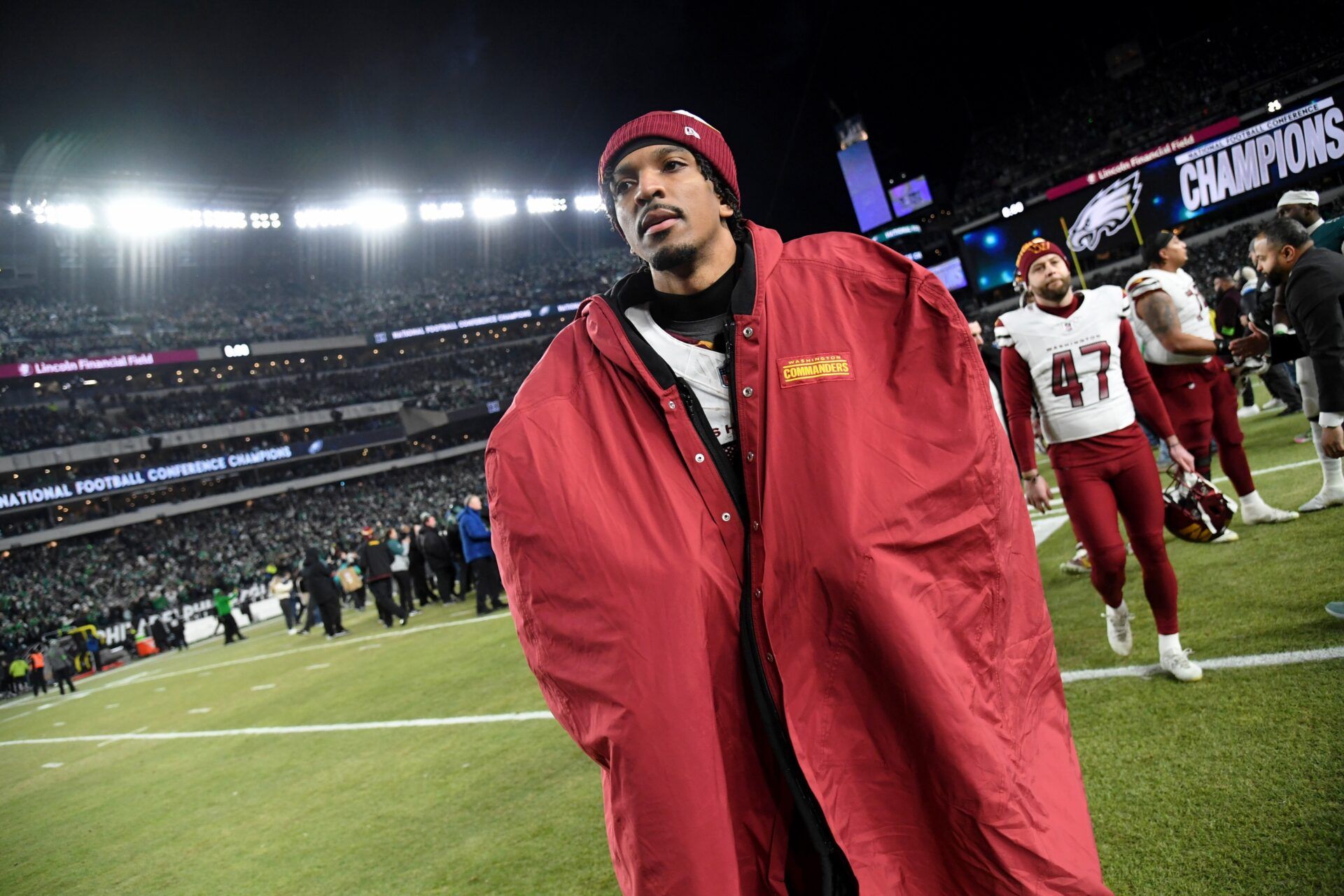 Washington Commanders quarterback Jayden Daniels (5) walks off the field after losing the NFC Championship game against the Philadelphia Eagles at Lincoln Financial Field.