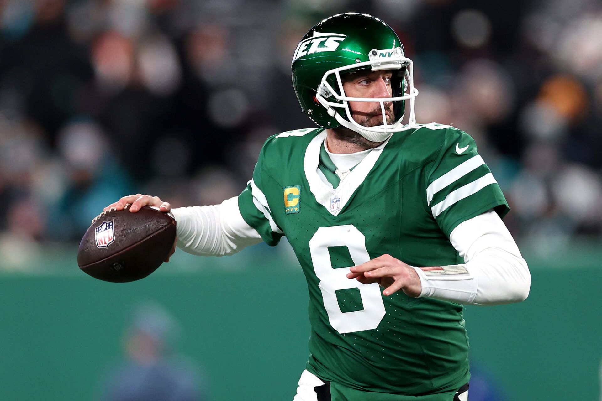 EAST RUTHERFORD, NEW JERSEY - JANUARY 05: Aaron Rodgers #8 of the New York Jets in action against the Miami Dolphins at MetLife Stadium on January 05, 2025 in East Rutherford, New Jersey. (Photo by Luke Hales/Getty Images)