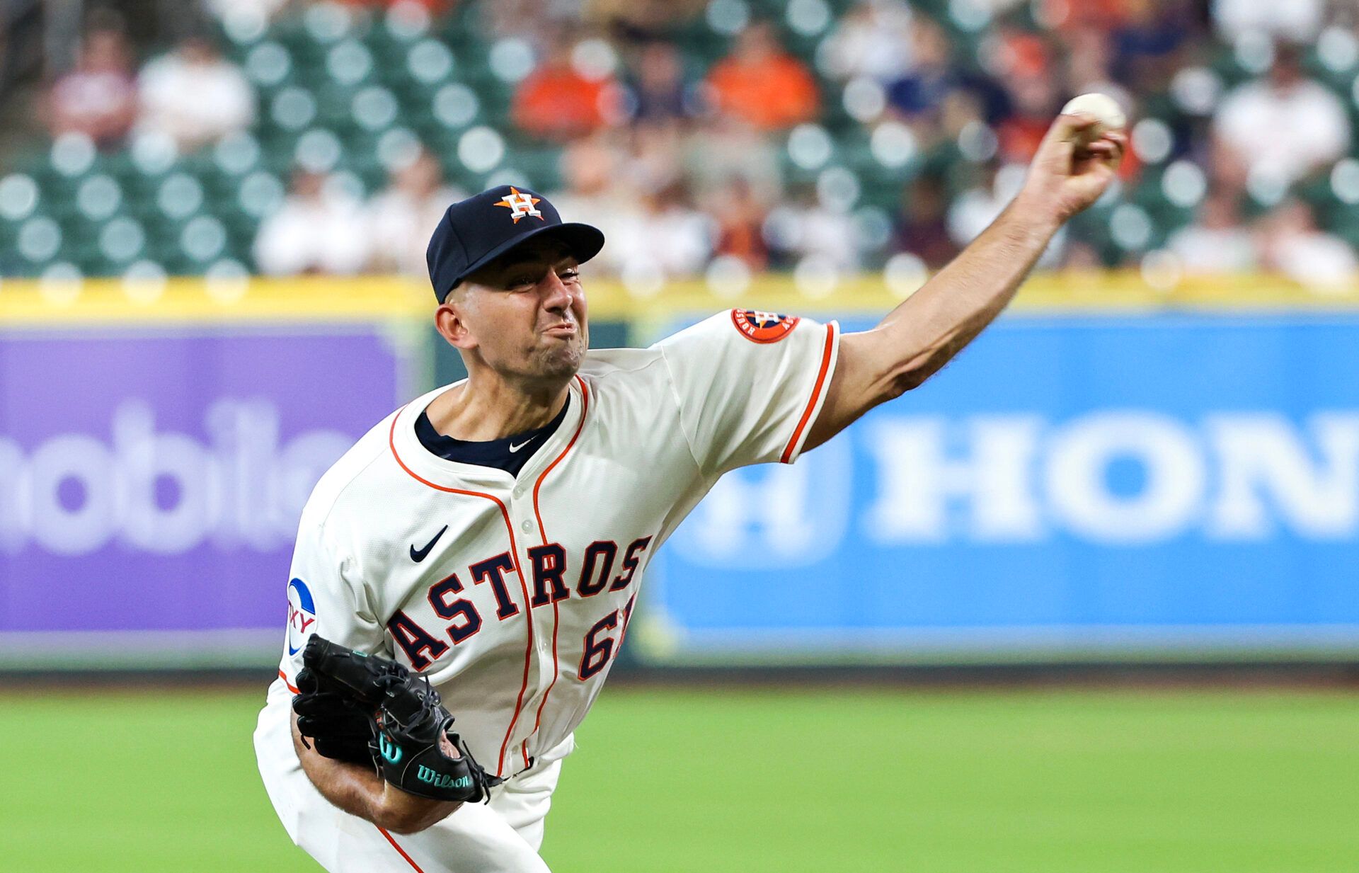Houston Astros starting pitcher Colton Gordon (61) pitches against the Kansas City Royals  in the first inning at  Daikin Park.