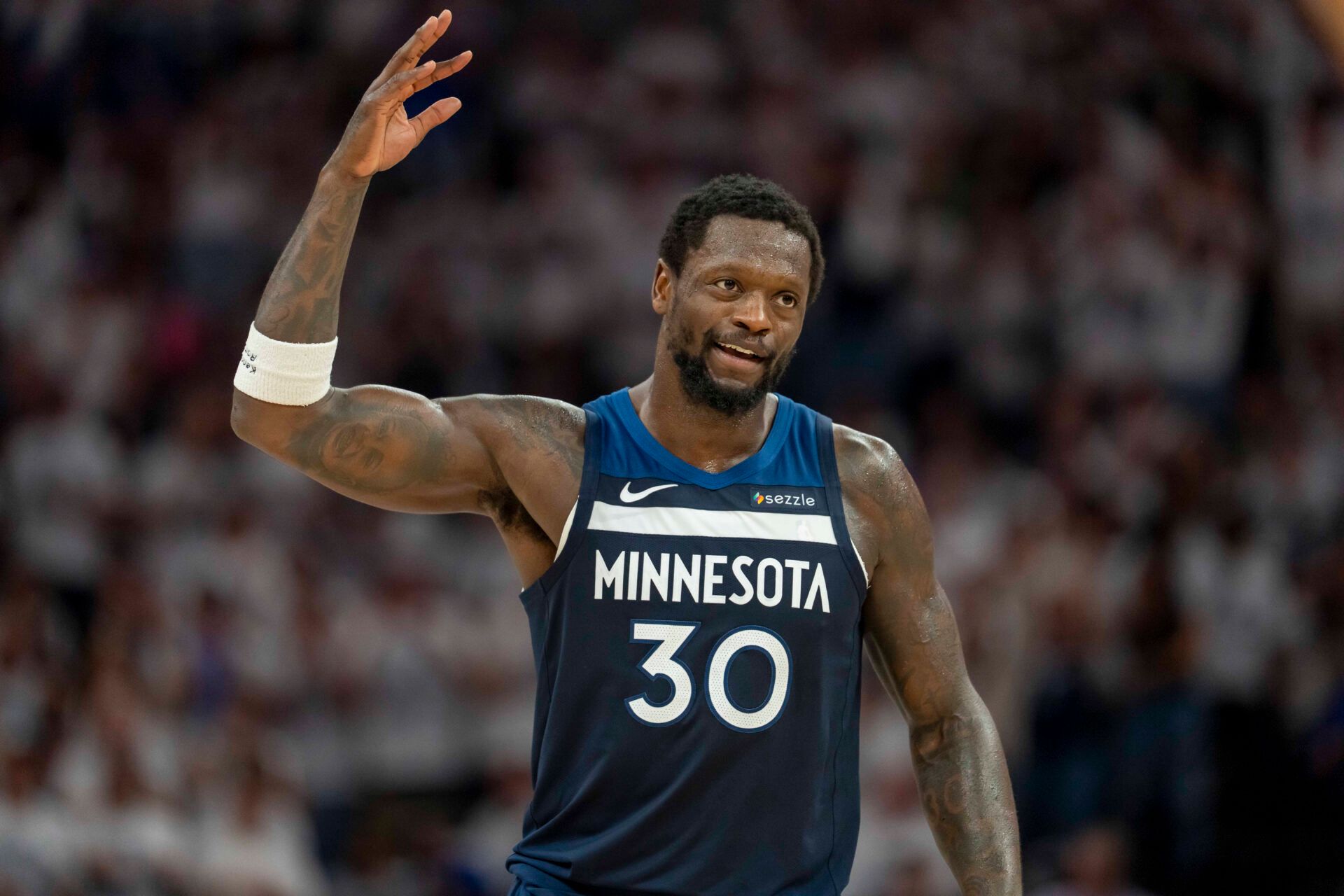 Minnesota Timberwolves forward Julius Randle (30) raises his arm to pump up the crowd after making a shot against the Golden State Warriors in the first half during game five of the second round for the 2025 NBA Playoffs at Target Center.
