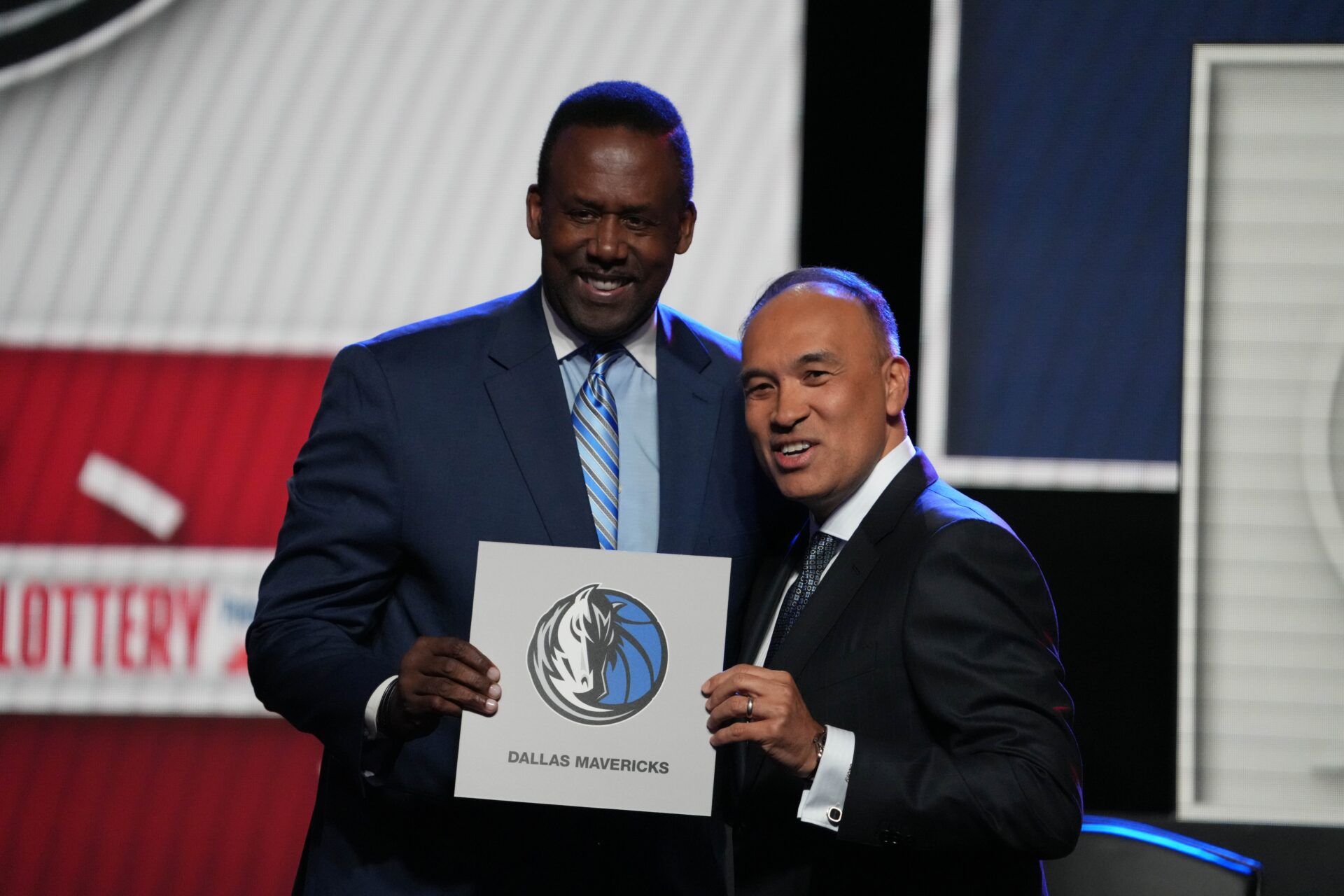 Rolando Blackman of the Dallas Mavericks poses with Mark Tatum NBA Deputy Commissioner after winning the the first pick during the 2025 NBA Draft Lottery at McCormick Place.