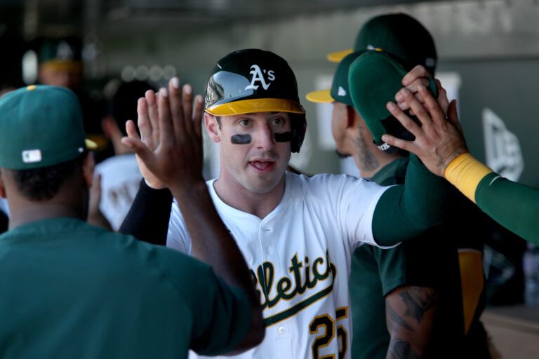Athletics right fielder Brent Rooker (25) celebrates after scoring a run off a three run home run by Shea Langeliers (not pictured) against the New York Yankees during the seventh inning at Sutter Health Park.