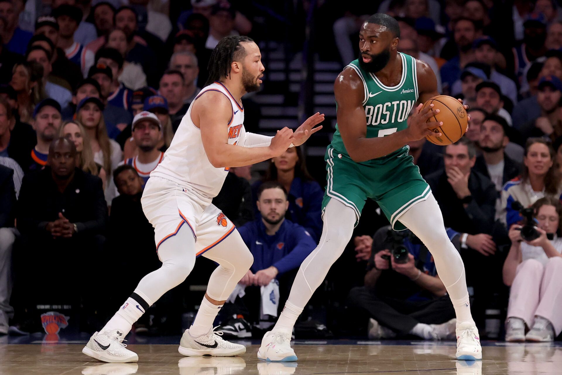Boston Celtics guard Jaylen Brown (7) controls the ball against New York Knicks guard Jalen Brunson (11) during the first quarter of game six in the second round of the 2025 NBA Playoffs at Madison Square Garden.