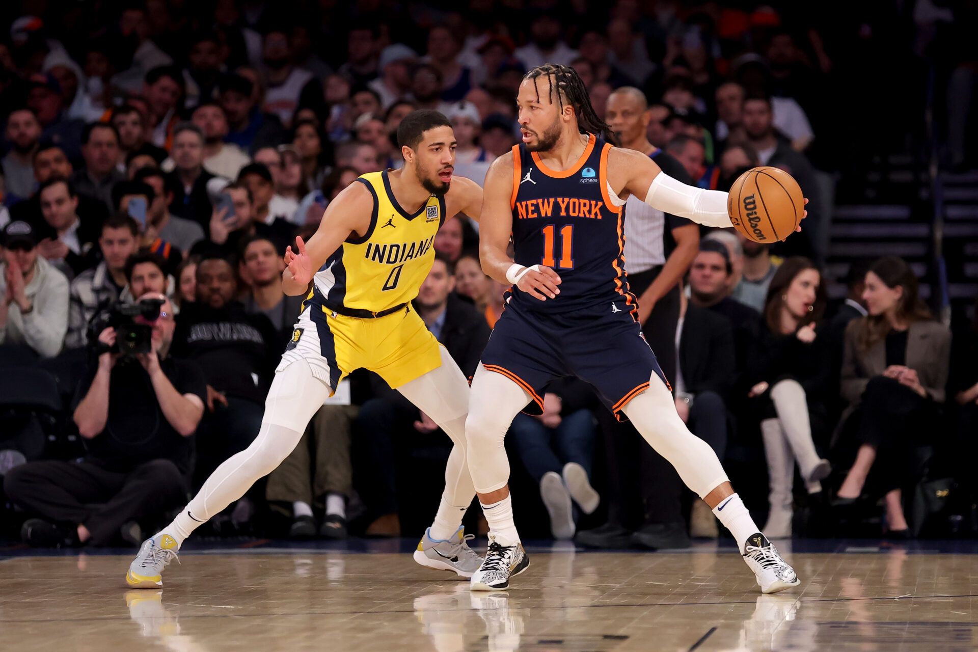 New York Knicks guard Jalen Brunson (11) controls the ball against Indiana Pacers guard Tyrese Haliburton (0) during the first quarter at Madison Square Garden.