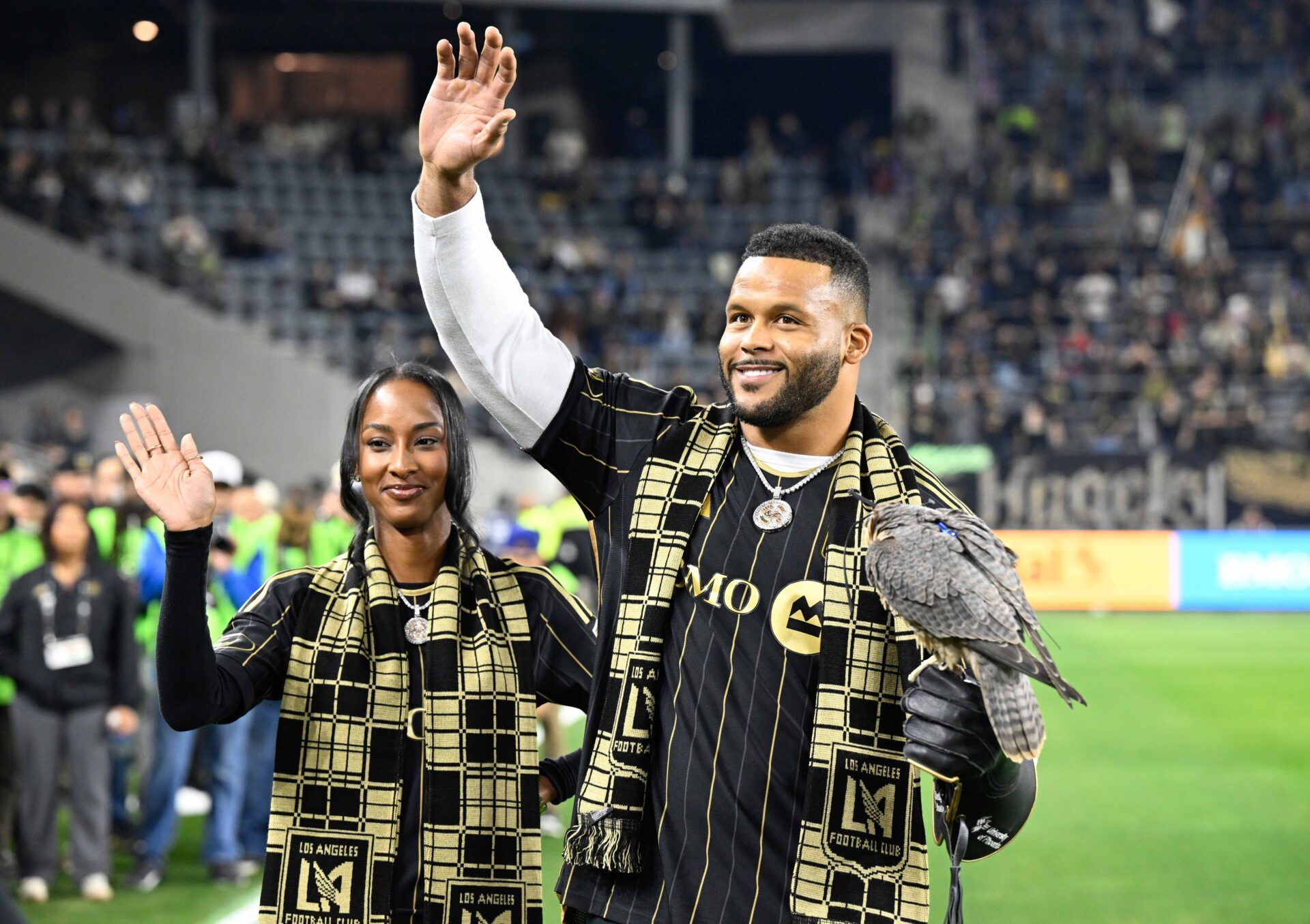 Los Angeles Rams former player Aaron Donald with the falcon before a match between the Los Angeles FC and the Vancouver Whitecaps at BMO Stadium.