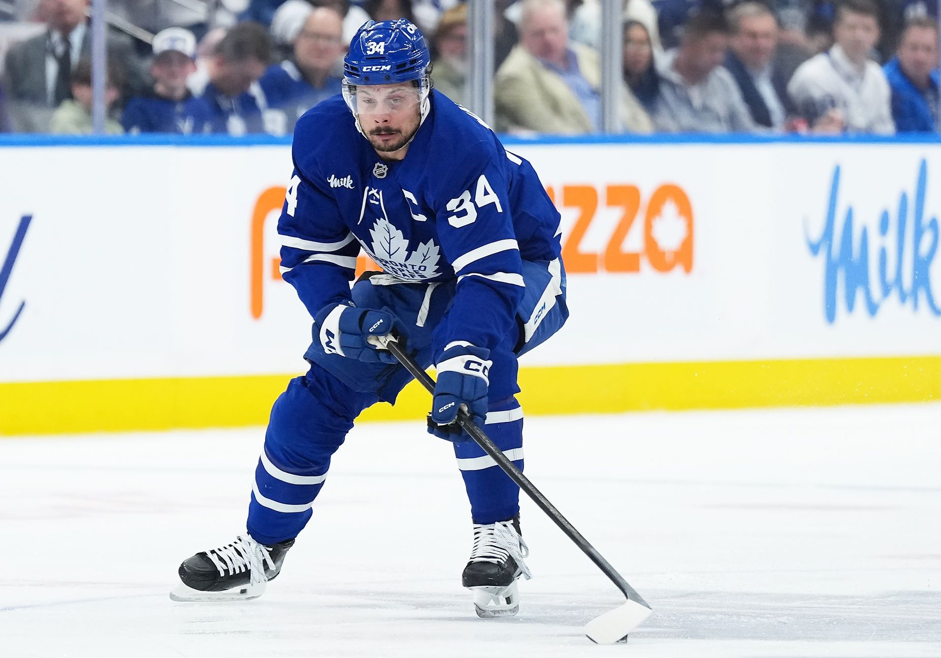 Toronto Maple Leafs center Auston Matthews (34) skates with the puck against the Florida Panthers during the first period in game two of the second round of the 2025 Stanley Cup Playoffs at Scotiabank Arena.
