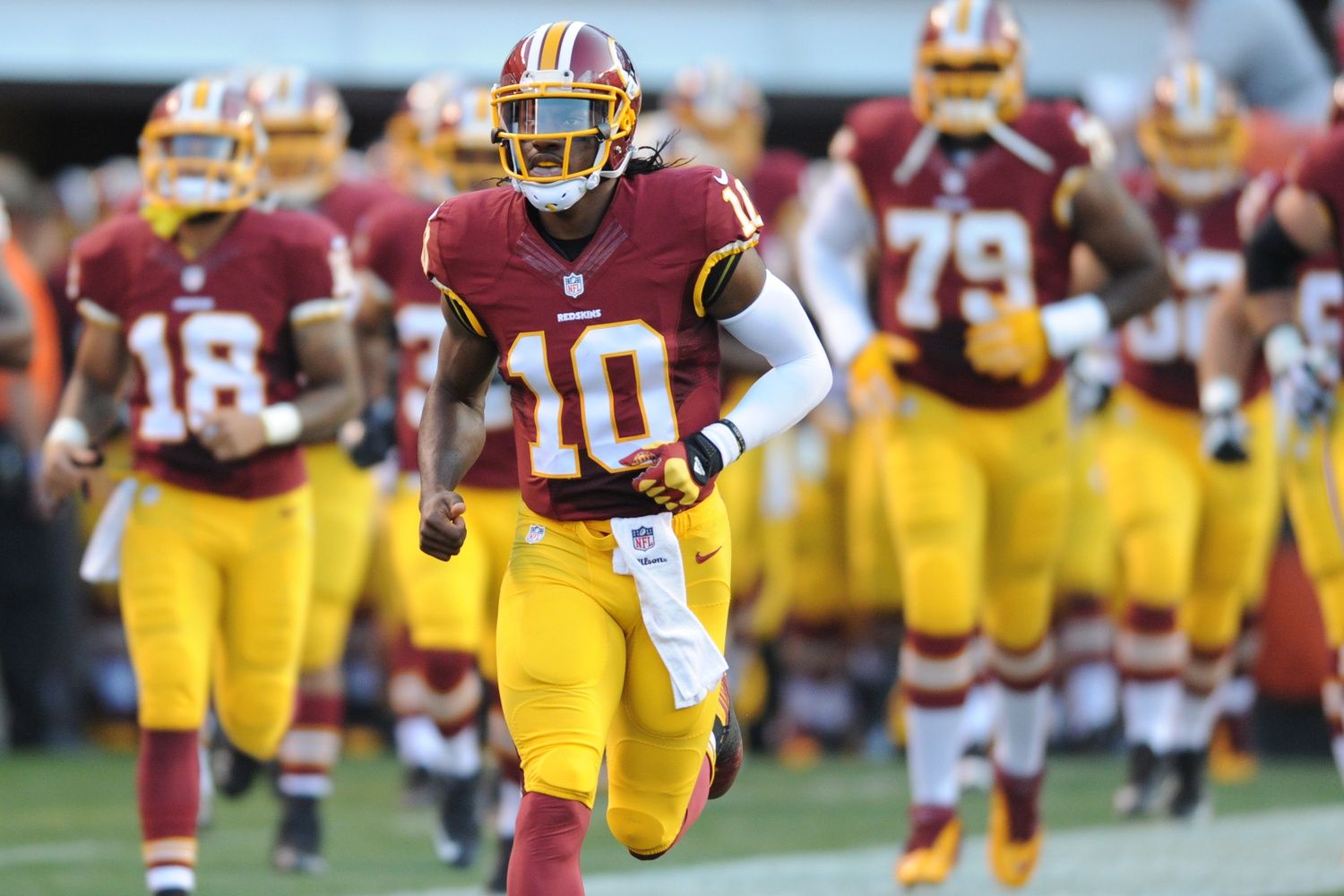 Washington Redskins quarterback Robert Griffin III (10) leads the team out of the tunnel in a preseason NFL football game at FirstEnergy Stadium.