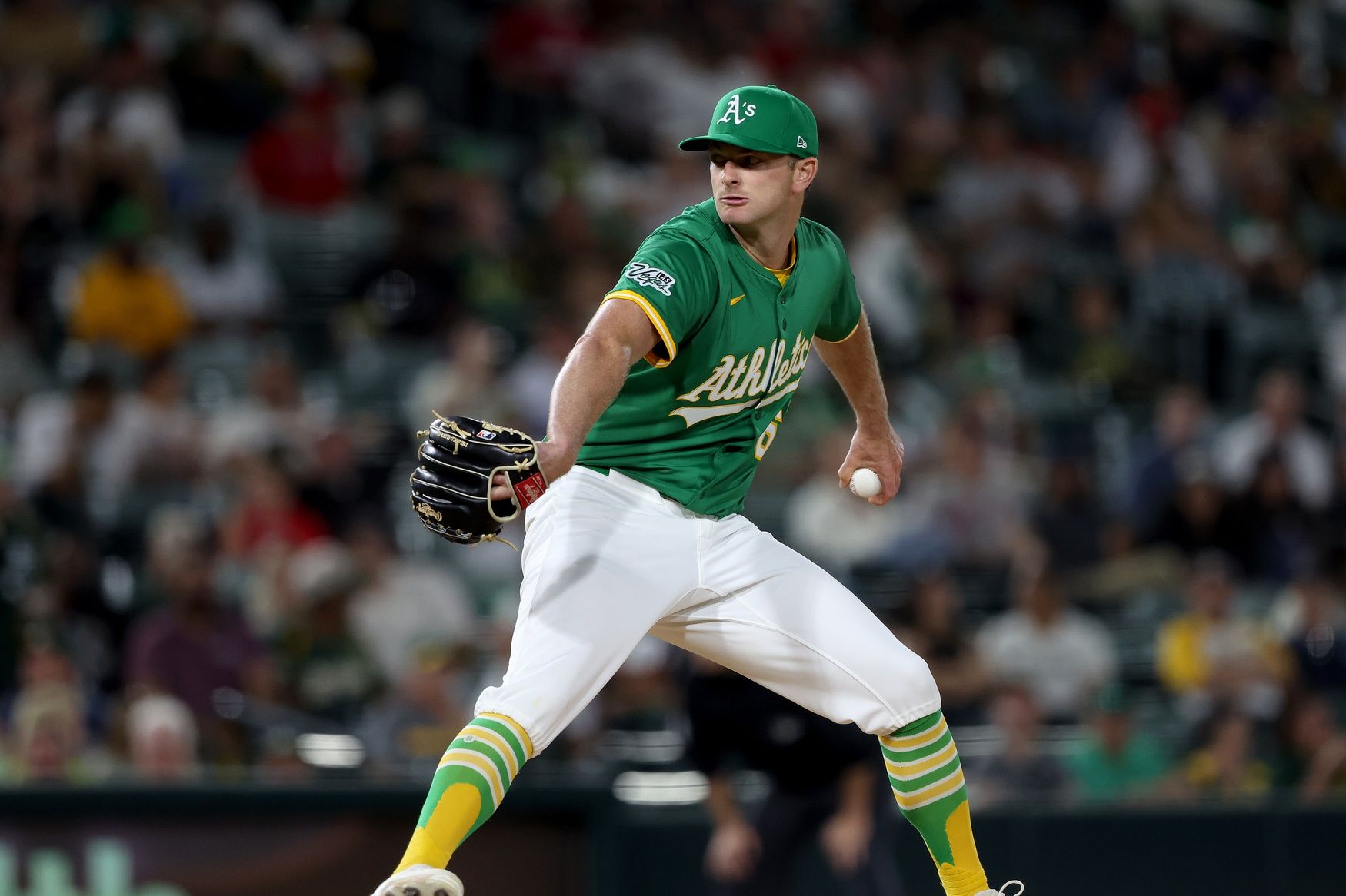 Athletics pitcher Matt Krook (62) throws a pitch against the Los Angeles Angels during the seventh inning at Sutter Health Park.