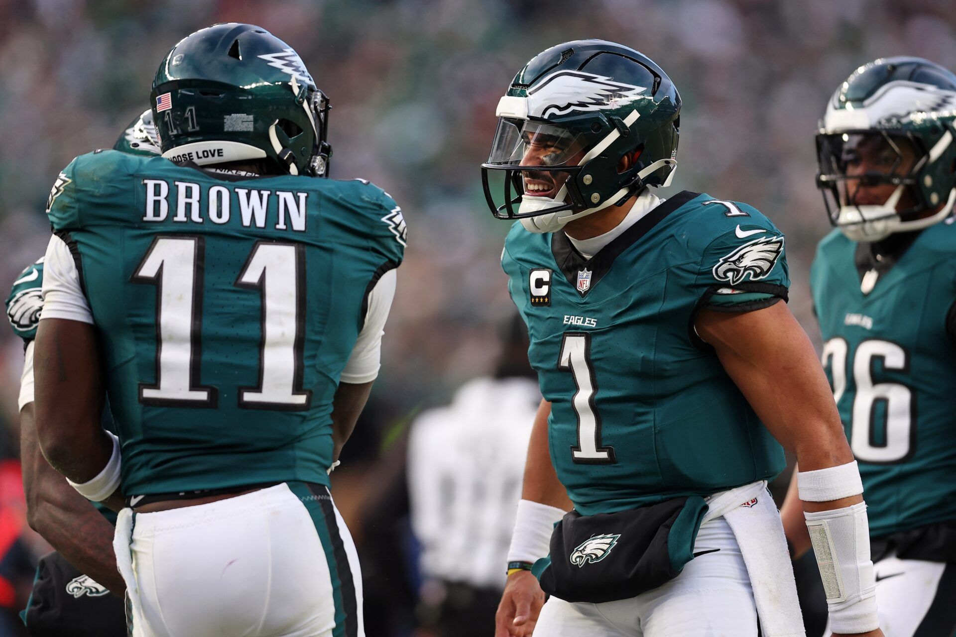 Philadelphia Eagles quarterback Jalen Hurts (1) and wide receiver A.J. Brown (11) celebrate after a touchdown against the Washington Commanders during the first half in the NFC Championship game at Lincoln Financial Field.