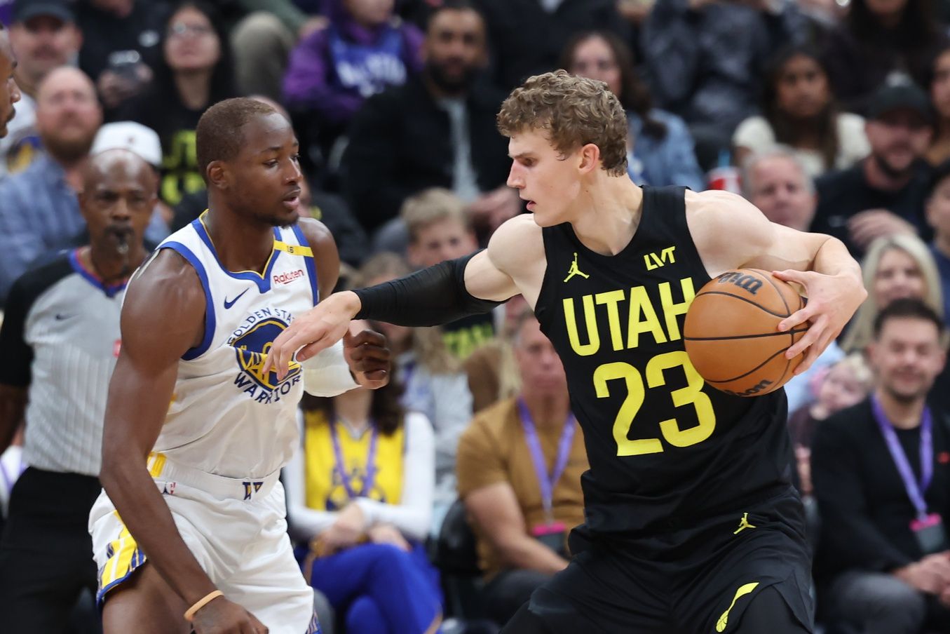 Utah Jazz forward Lauri Markkanen (23) posts up on Golden State Warriors forward Jonathan Kuminga (00) during the second quarter at Delta Center.