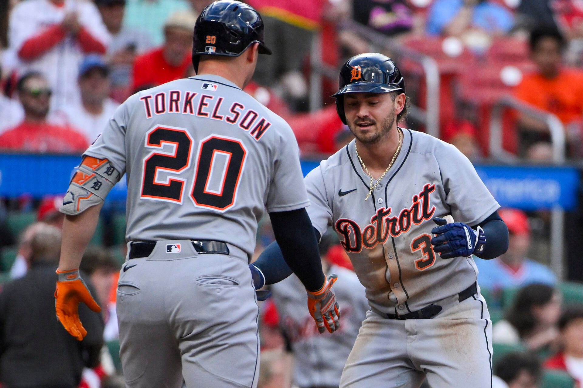 Detroit Tigers third baseman Zach McKinstry (39) is congratulated by first baseman Spencer Torkelson (20) after scoring against the St. Louis Cardinals during the first inning at Busch Stadium.