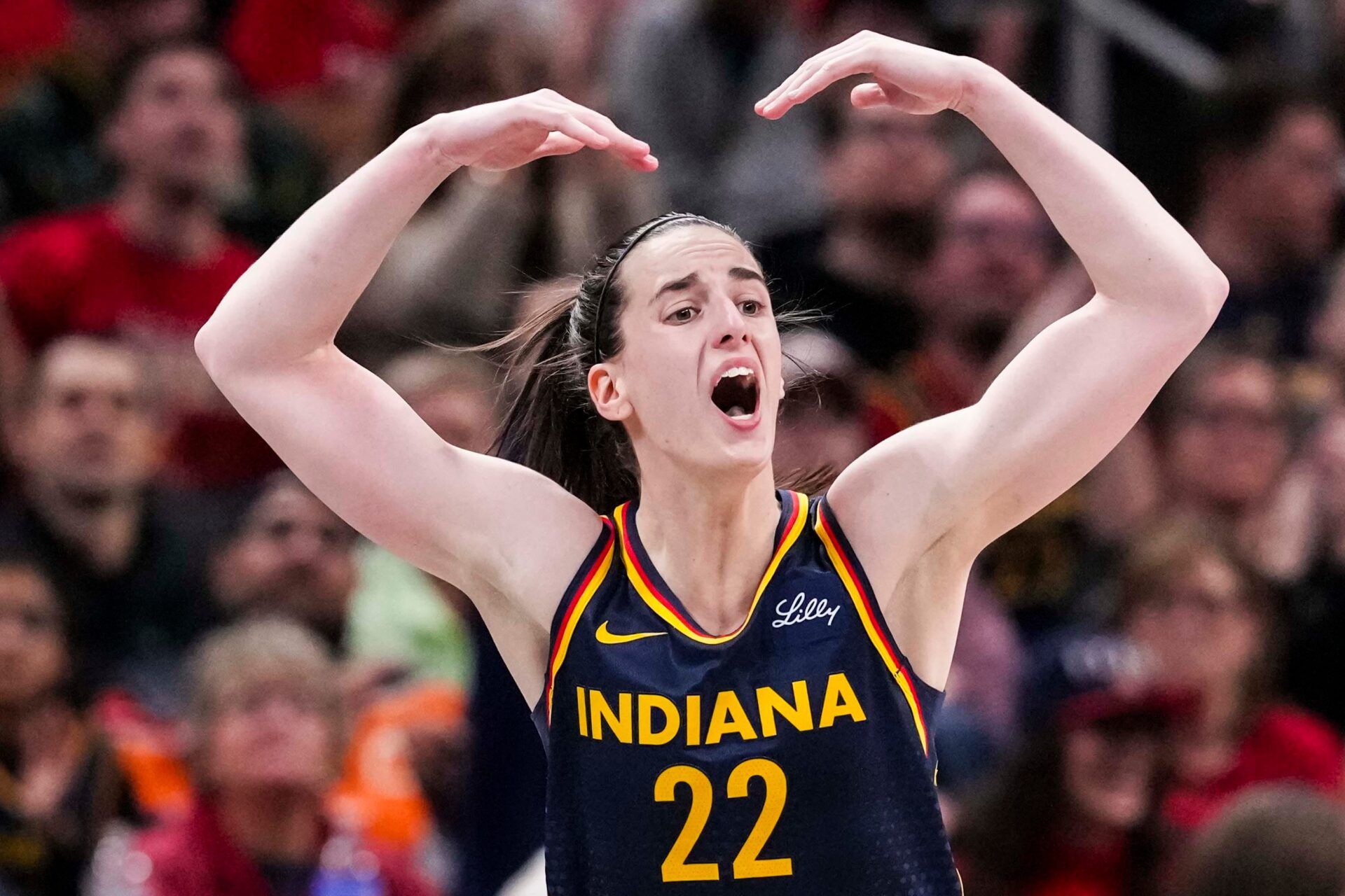 Indiana Fever guard Caitlin Clark (22) gets the crowd excited Tuesday, May 20, 2025, during a game between the Indiana Fever and the Atlanta Dream at Gainbridge Fieldhouse in Indianapolis. The Atlanta Dream defeated the Indiana Fever, 91-90.