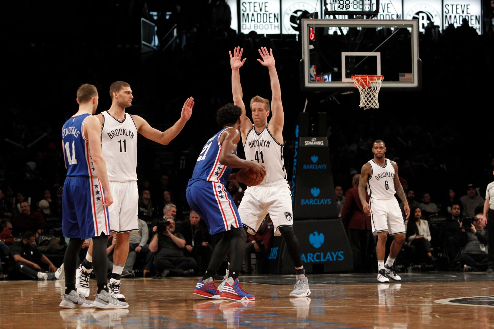Brooklyn Nets center Justin Hamilton (41) tries to block a shot against Philadelphia 76ers center Joel Embiid (21) in the fourth quarter at Barclays Center.  Sixers win 105-95.
