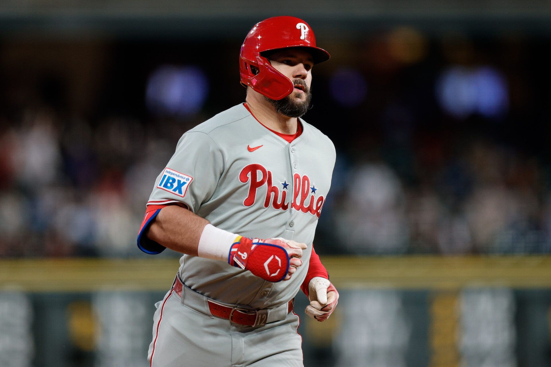Philadelphia Phillies designated hitter Kyle Schwarber (12) rounds the bases on a solo home run in the seventh inning against the Colorado Rockies at Coors Field.