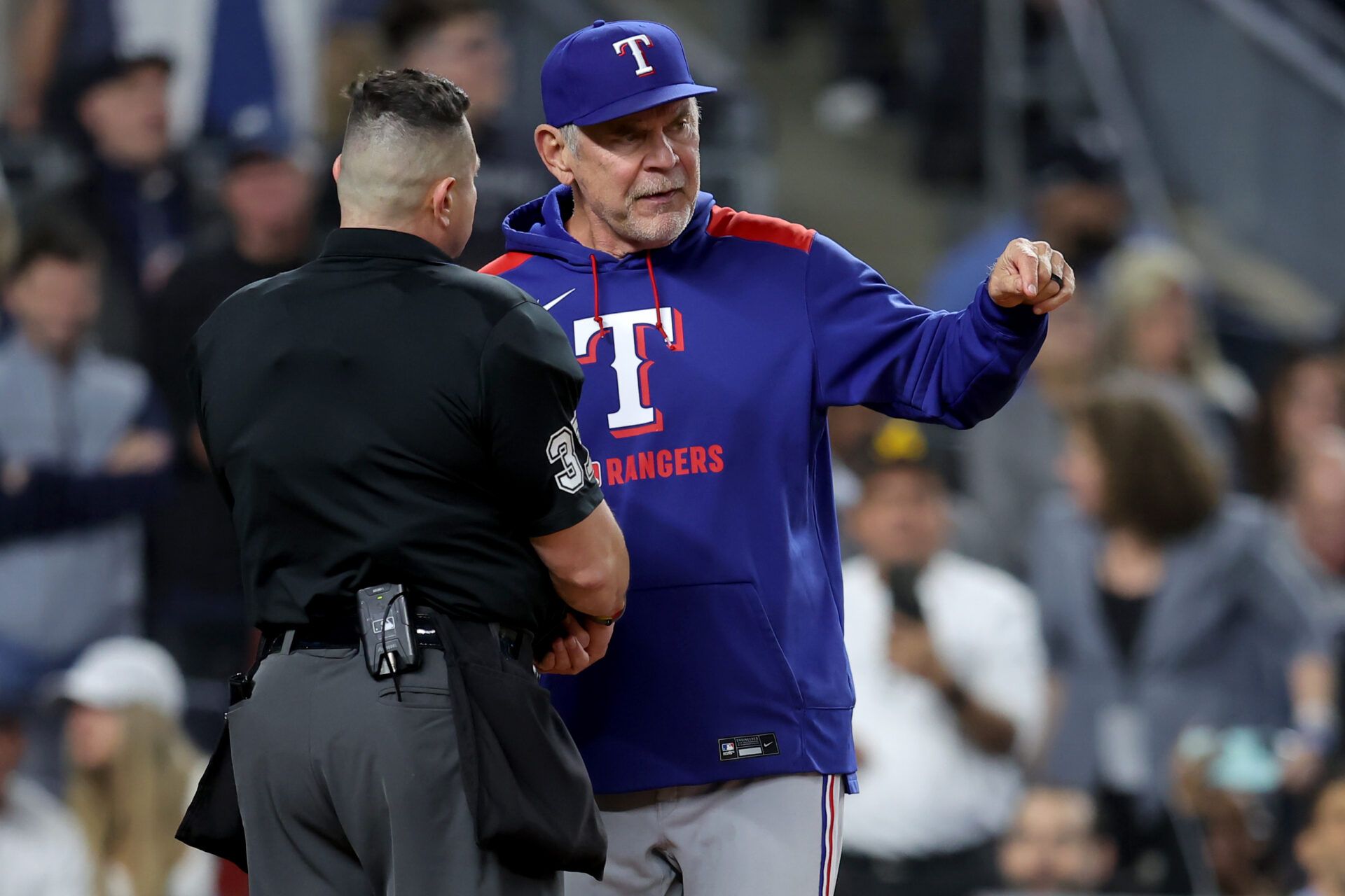 Texas Rangers manager Bruce Bochy (15) argues with home plate umpire Carlos Torres (37) after being ejected during the sixth inning against the New York Yankees at Yankee Stadium.