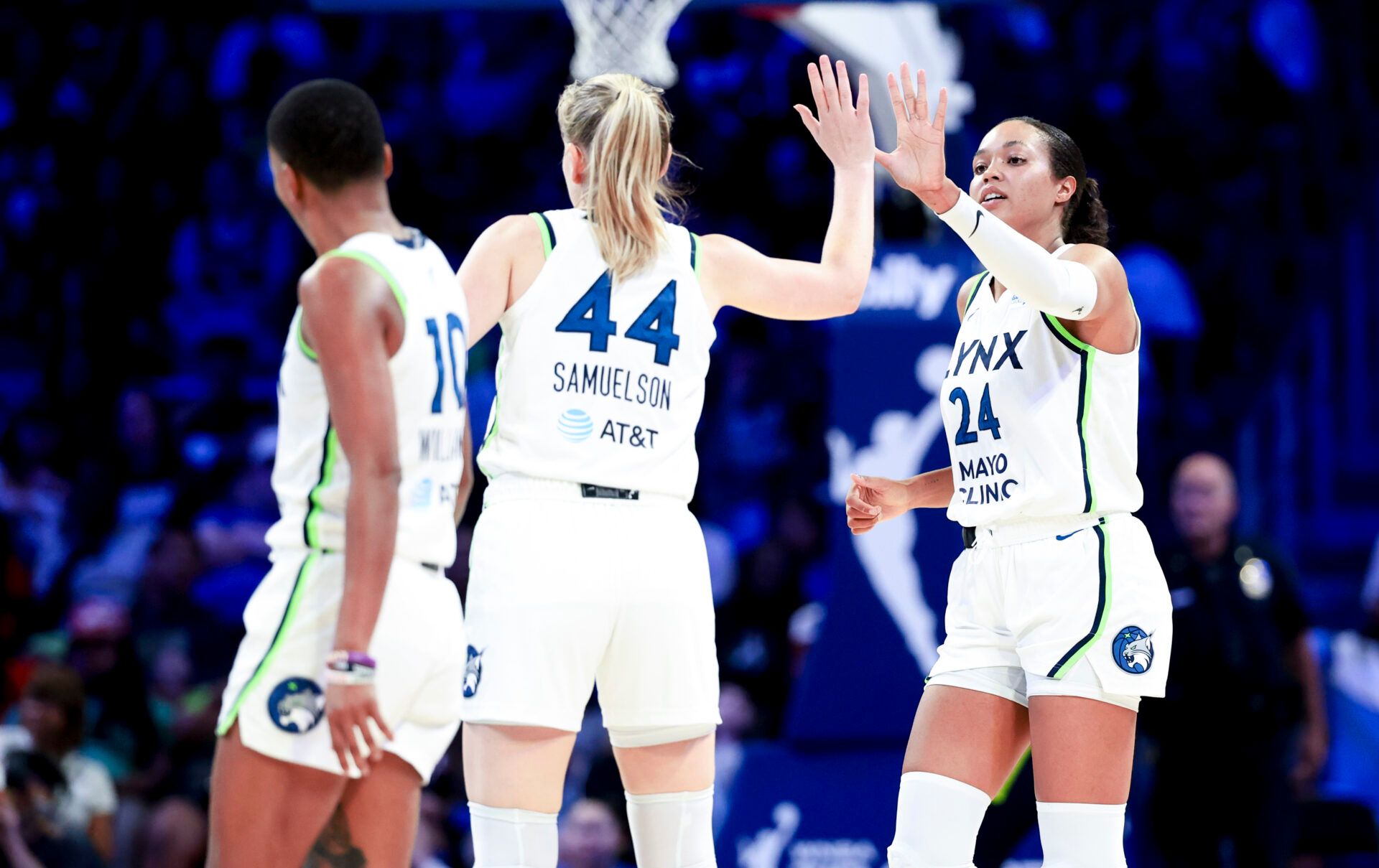Minnesota Lynx forward Napheesa Collier (24) celebrates with Minnesota Lynx forward Karlie Samuelson (44) and Minnesota Lynx guard Courtney Williams (10) during the second half against the Dallas Wings at College Park Center.