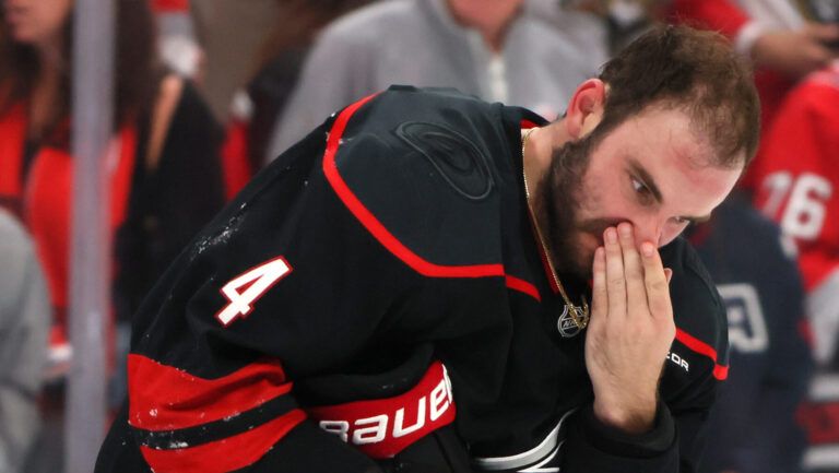 RALEIGH, NORTH CAROLINA - MAY 20: Shayne Gostisbehere #4 of the Carolina Hurricanes reacts after a fight with Brad Marchand #63 of the Florida Panthers during the third period in Game One of the Eastern Conference Final of the 2025 Stanley Cup Playoffs at Lenovo Center on May 20, 2025 in Raleigh, North Carolina. (Photo by Bruce Bennett/Getty Images)