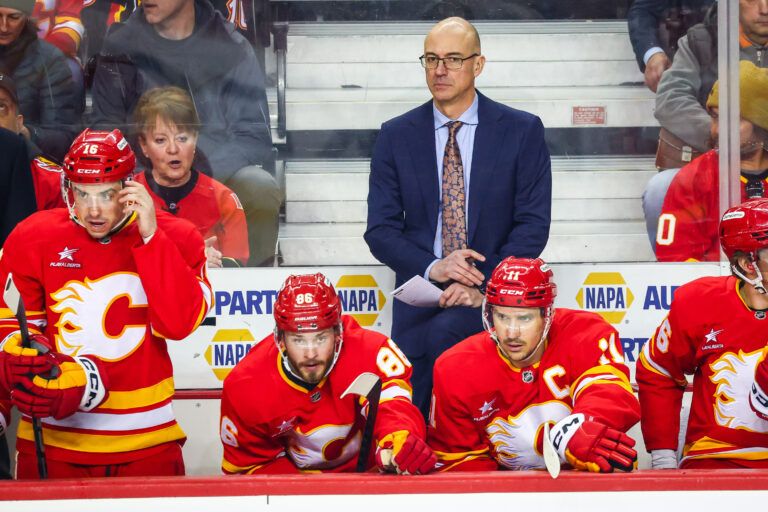 Calgary Flames head coach Ryan Huska on his bench against the San Jose Sharks during the first period at Scotiabank Saddledome.