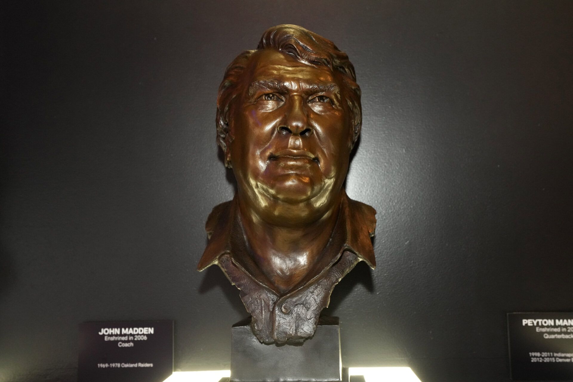 The bust of Oakland Raiders coach John Madden at the Pro Football Hall of Fame exhibit at the NFL Experience at the Mandalay Bay South Convention Center.