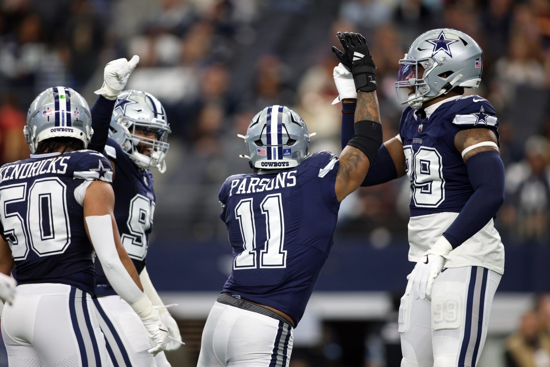 Dallas Cowboys linebacker Micah Parsons (11) celebrates a sack against the Washington Commanders during the first quarter at AT&T Stadium.