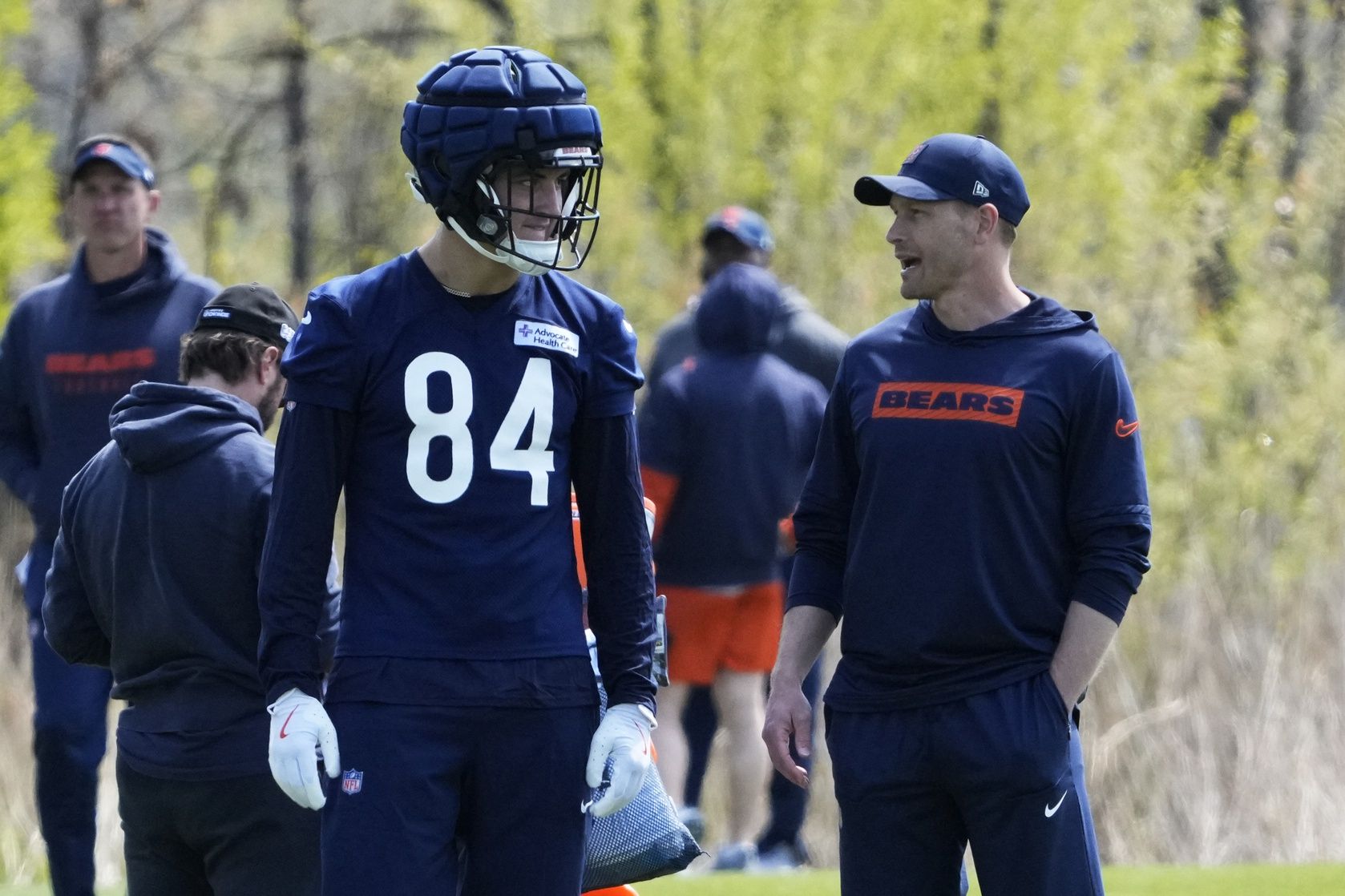Chicago Bears head coach Ben Johnson talks with tight end (84) Colston Loveland during Rookie Minicamp at Halas Hall.