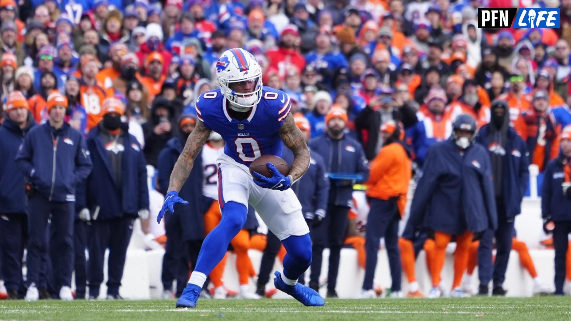 Buffalo Bills wide receiver Keon Coleman (0) runs for a gain during the first quarter against the Denver Broncos in an AFC wild card game at Highmark Stadium.