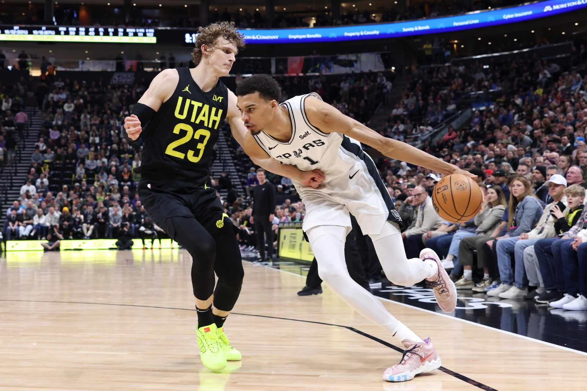 San Antonio Spurs center Victor Wembanyama (1) drives against Utah Jazz forward Lauri Markkanen (23) during the fourth quarter at Delta Center.