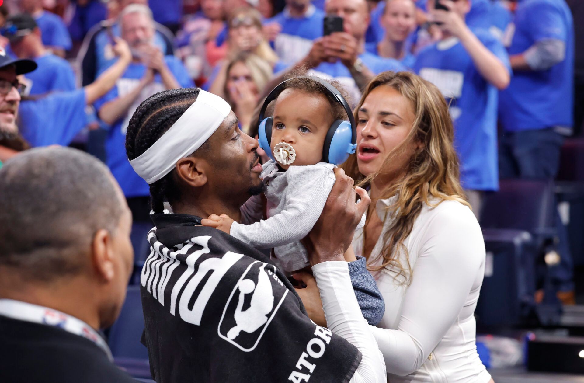 Oklahoma City Thunder guard Shai Gilgeous-Alexander (2) hugs his son Ares Alexander alongside his wife Hailey Summers after his team defeated the Denver Nuggets during game five of the second round for the 2025 NBA Playoffs at Paycom Center.