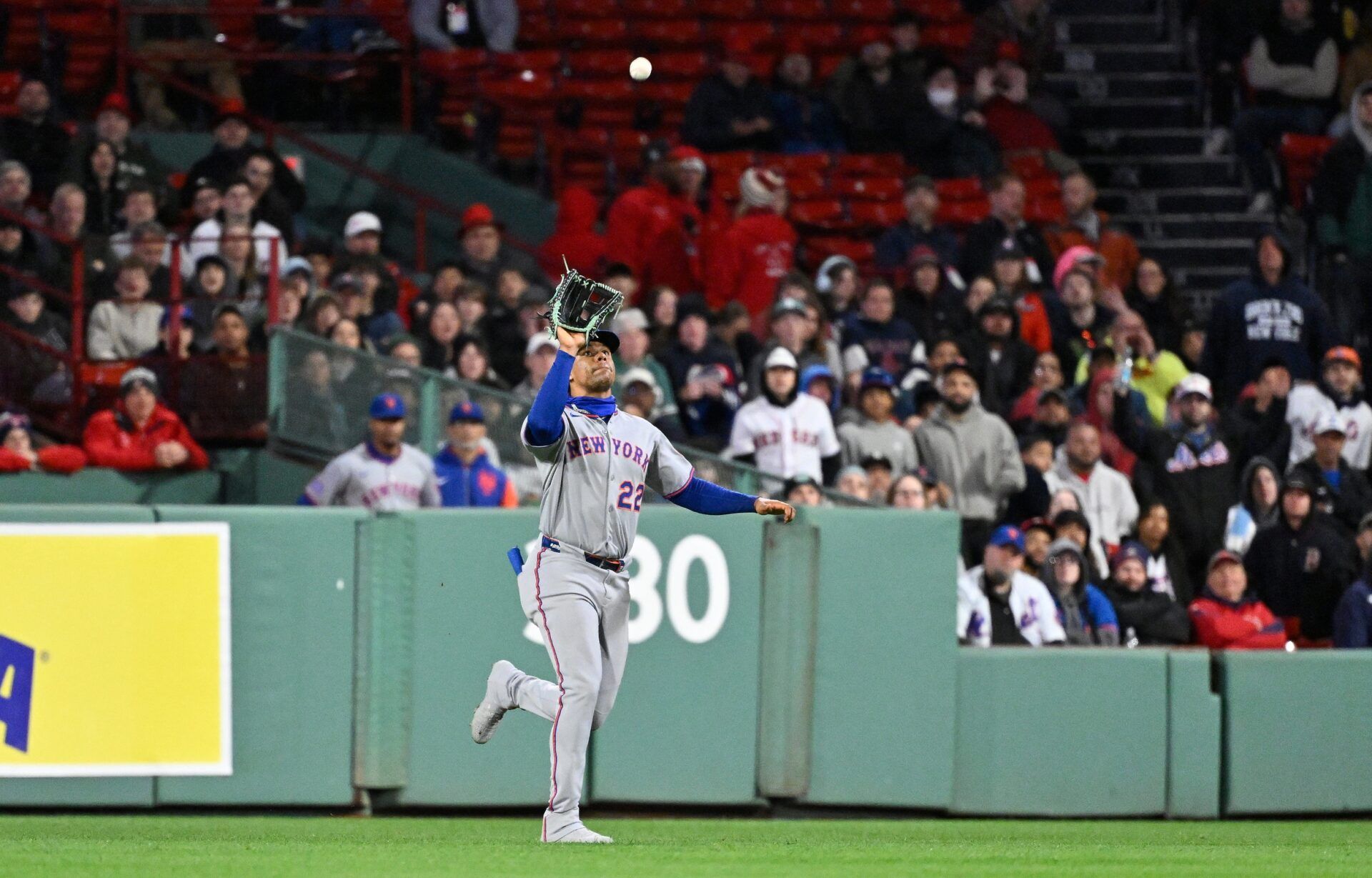 New York Mets right fielder Juan Soto (22) makes a catch against the Boston Red Sox during the ninth inning at Fenway Park.