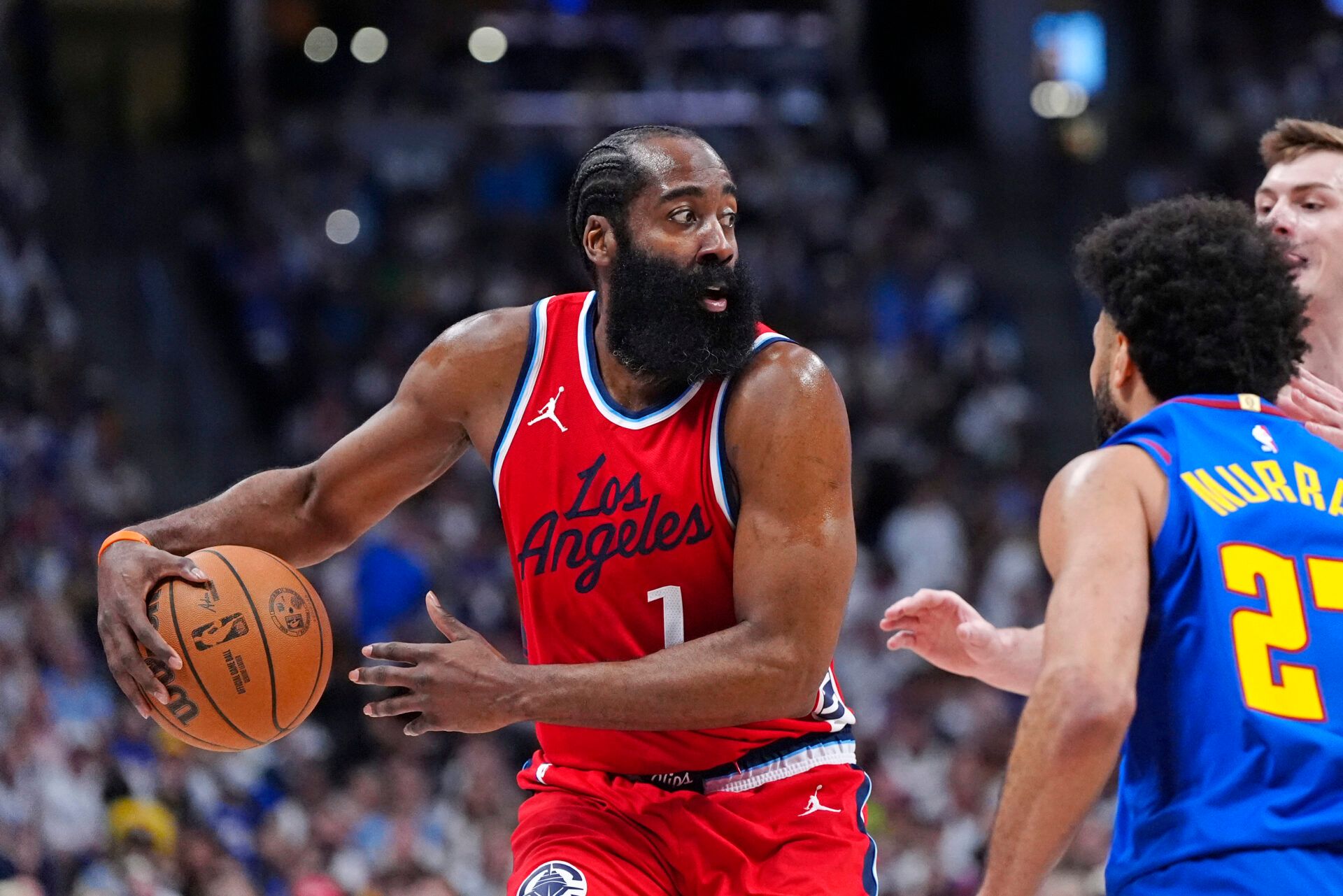 LA Clippers guard James Harden (1) prepares to pass the ball in the second quarter against the Denver Nuggets during game seven of first round for the 2025 NBA Playoffs at Ball Arena.