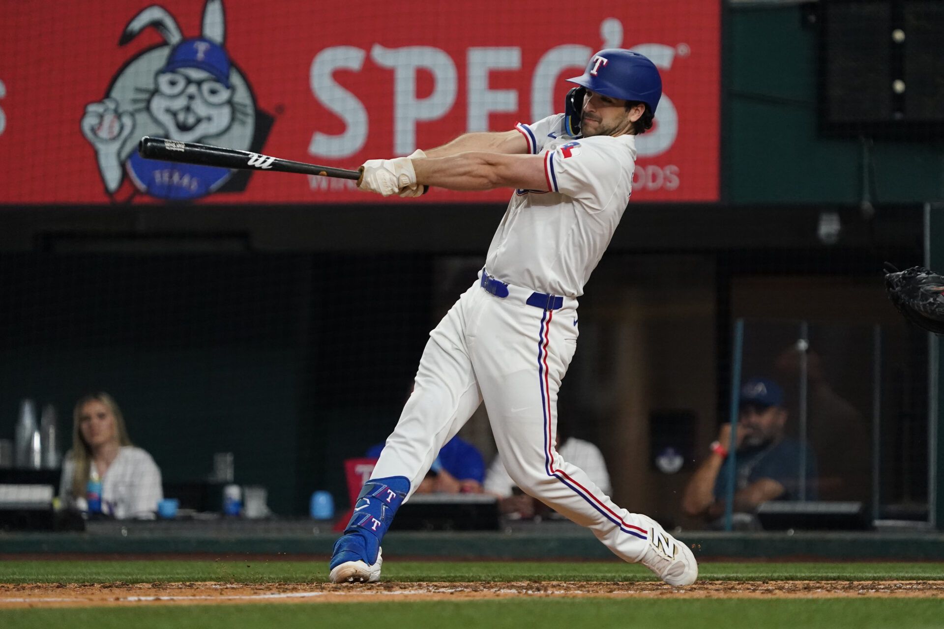 Texas Rangers shortstop Josh Smith (8) hits an RBI sacrifice fly during the seventh inning against the Houston Astros at Globe Life Field.