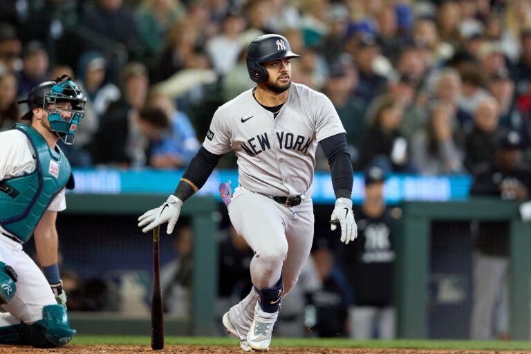 New York Yankees left fielder Jasson Dominguez (24) hits an RBI doube against the Seattle Mariners during the sixth inning at T-Mobile Park.