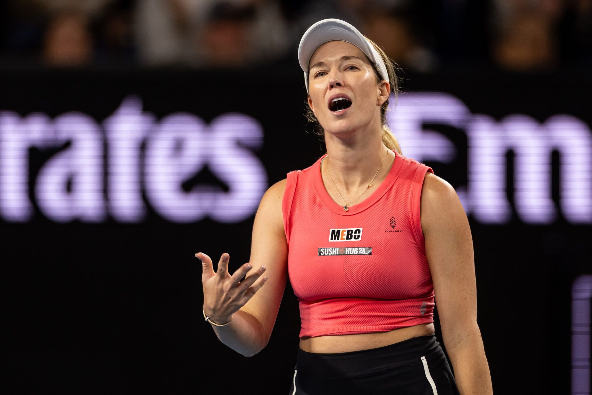 Danielle Collins of United States of America gestures during her women's singles match at the 2025 Australian Open at Melbourne Park.