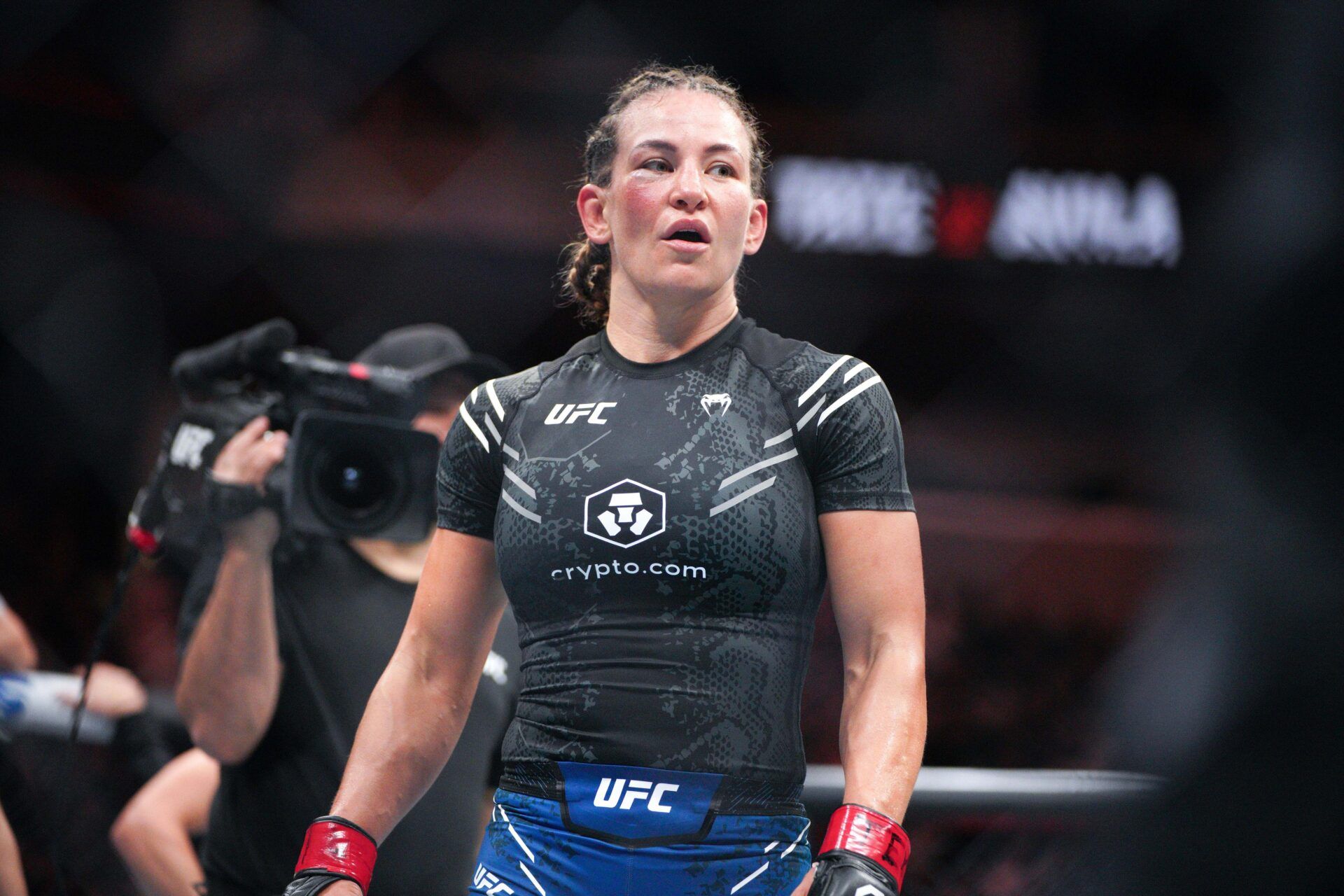 Miesha Tate (red gloves) fights Julia Avila (blue gloves) during UFC Fight Night at Moody Center.