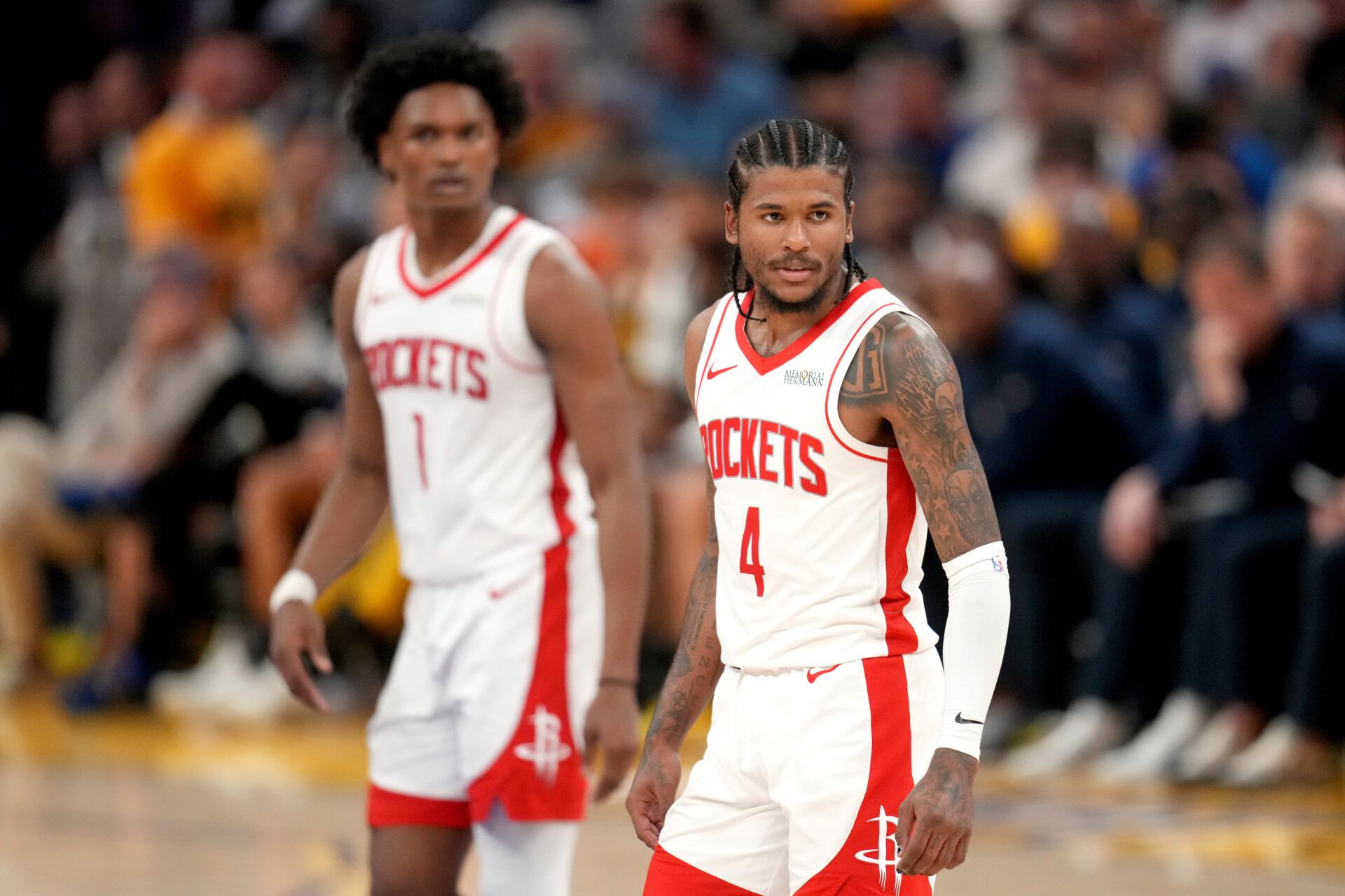 Houston Rockets guard Jalen Green (4) stands in front of forward Amen Thompson (1) during action against the Golden State Warriors in the fourth quarter of game six of the first round for the 2025 NBA Playoffs at Chase Center.