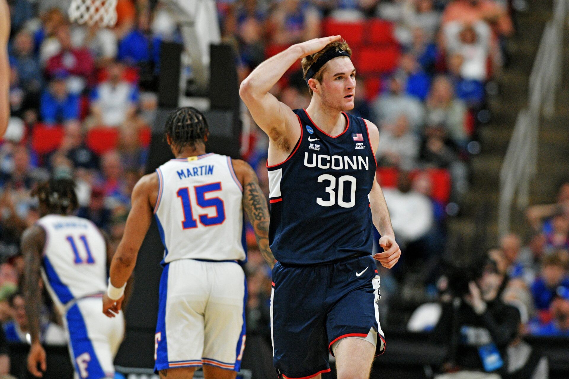 Connecticut Huskies forward Liam McNeeley (30) reacts after scoring a basket during the second half against the Florida Gators in the second round of the NCAA Tournament at Lenovo Center.