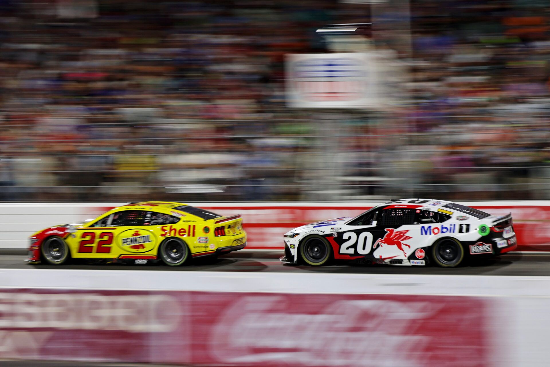 NASCAR Cup Series driver Joey Logano (22) and NASCAR Cup Series driver Christopher Bell (20) during NASCAR All-Star Race at North Wilkesboro Speedway.