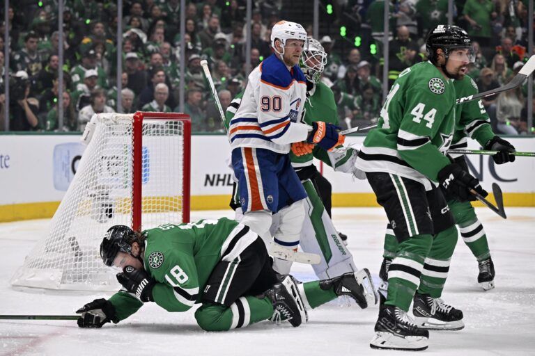 Edmonton Oilers right wing Corey Perry (90) is called for a high stick on Dallas Stars center Sam Steel (18) in the third period during game one of the Western Conference Final of the 2025 Stanley Cup Playoffs at American Airlines Center.