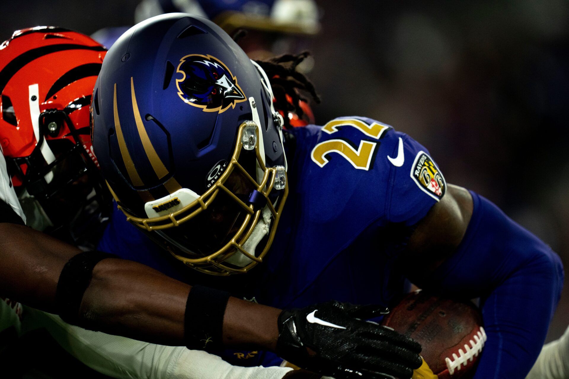 Cincinnati Bengals safety Jordan Battle (27) tackles Baltimore Ravens running back Derrick Henry (22) in the second quarter of the NFL game at M&T Banks Stadium in Baltimore on Thursday, Nov. 7, 2024.