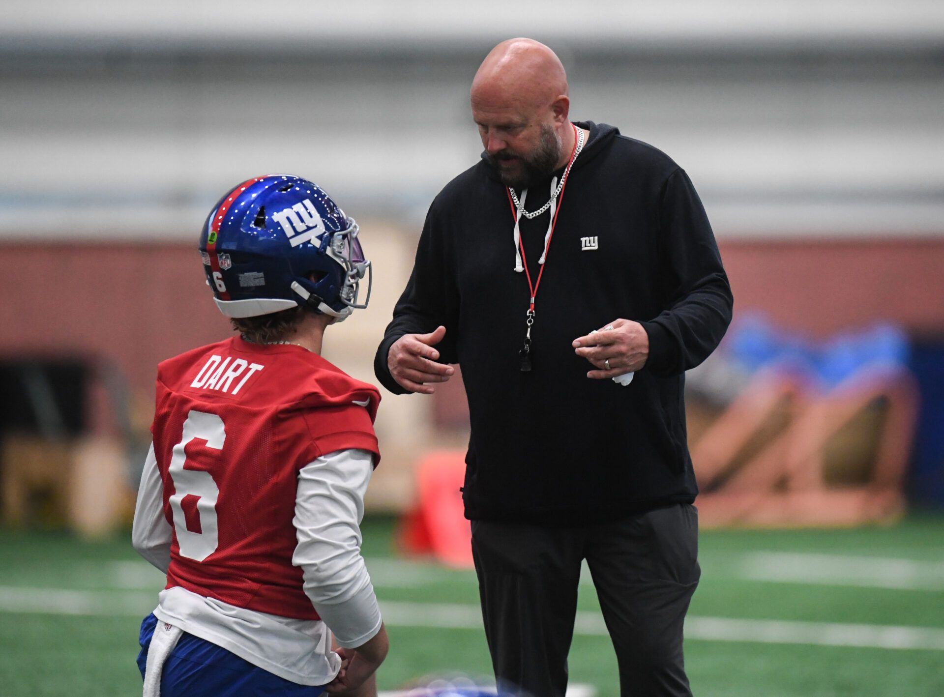 New York Giants head coach Brian Daboll talks with quarterback Jaxson Dart (6) during rookie minicamp at Quest Diagnostics Training Center.