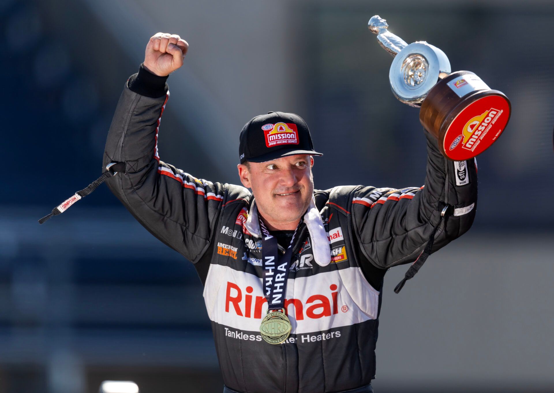 NHRA top fuel driver Tony Stewart celebrates after winning the Route 66 Nationals at Route 66 Raceway.